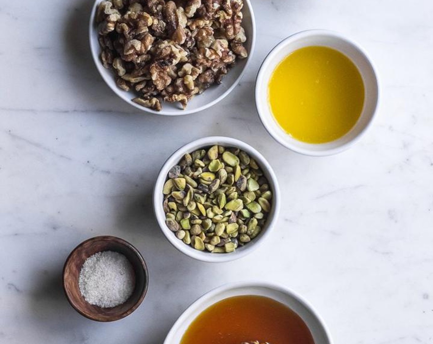 step 2 Grind Walnut (1/2 cup) and Pistachios (1/2 cup) in a food processor until desired texture is achieved. Add in Butter (2 Tbsp) , Simply Organic Cinnamon, Ground (1 tsp), Honey (2 Tbsp) & Salt (1 pinch), pulse to combine with nuts.