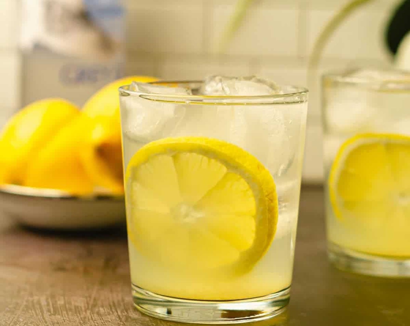 step 2 Strain into cocktail glasses that are filled with ice. Garnish with a lemon slice or wedge and enjoy!