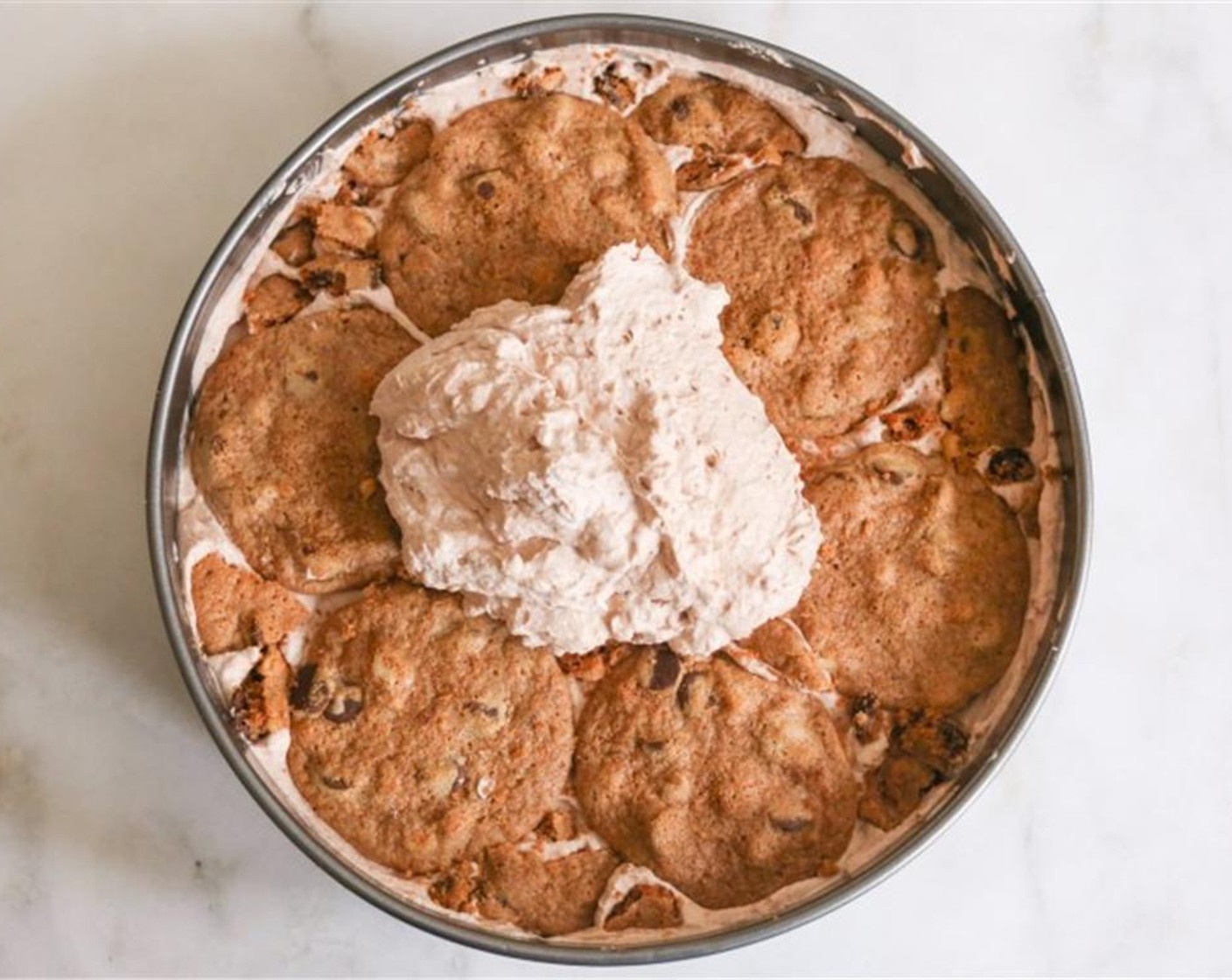 step 4 Spread a fifth of the nutella whipped cream over the cookies in an even layer. Repeat process with layers of cookie and layers of cream until there are 5 layers of each, finishing with a layer of cream. Smooth the top.