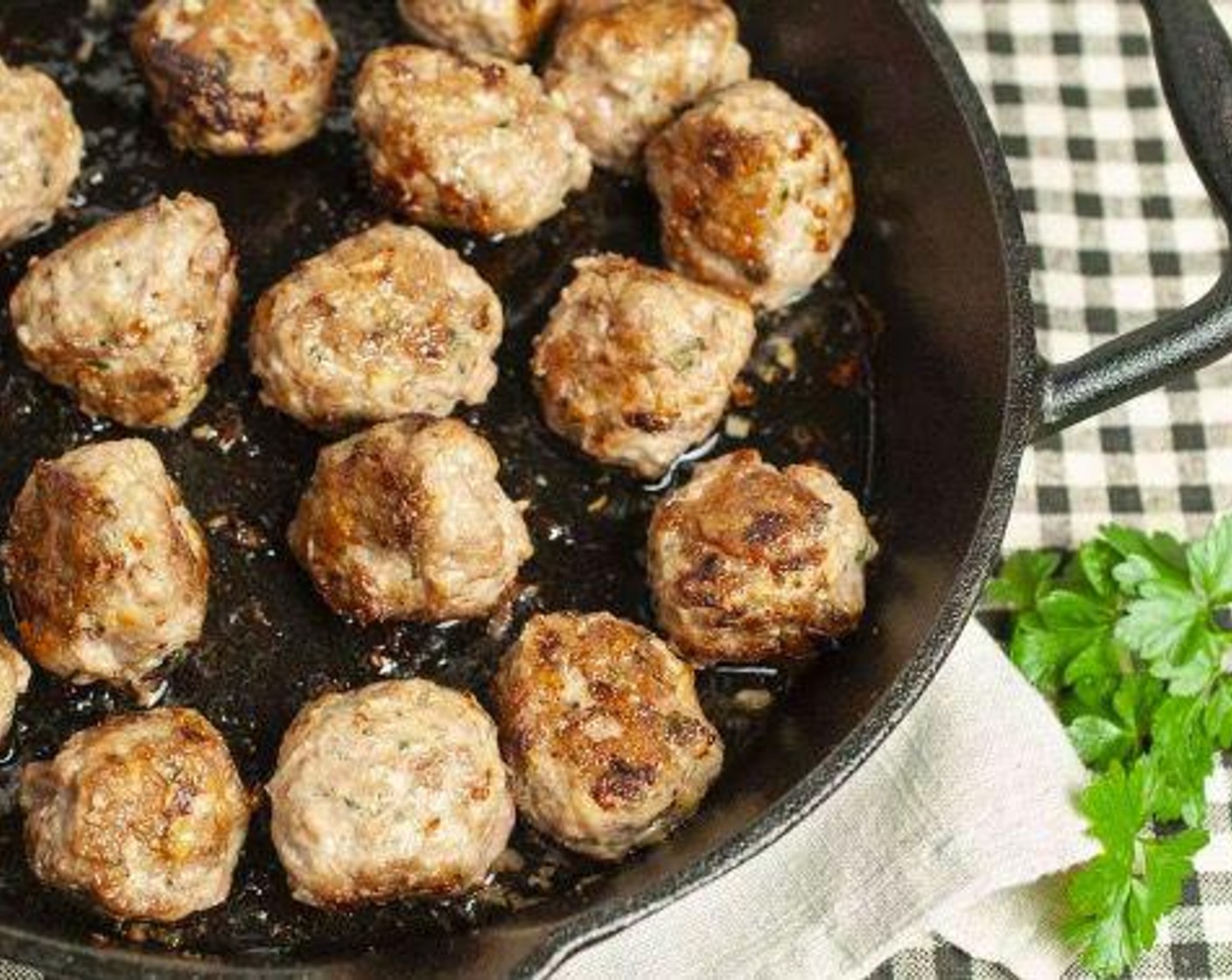 step 3 Heat Canola Oil (1 Tbsp) in a cast iron or oven-safe skillet over medium heat until hot. Arrange meatballs in a single layer and brown on all sides, about 20 minutes. Remove meatballs to a paper towel-lined plate and drain all but 1 tablespoon of fat from the skillet.