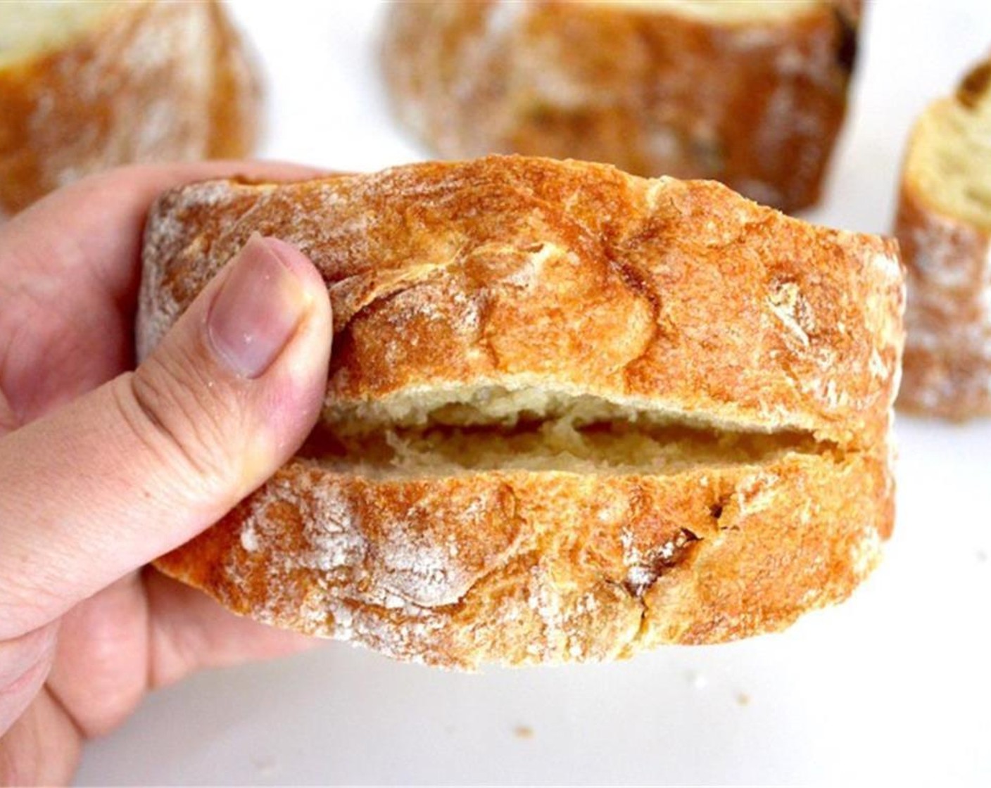 step 1 Take the Ciabatta Bread (1/2 loaf) and slice it into 4 thick, equal slices. Remove the heel and set it aside to dip in pasta sauce later! Then gently slice an opening through the middle of each slice to make a large pocket for the filling.