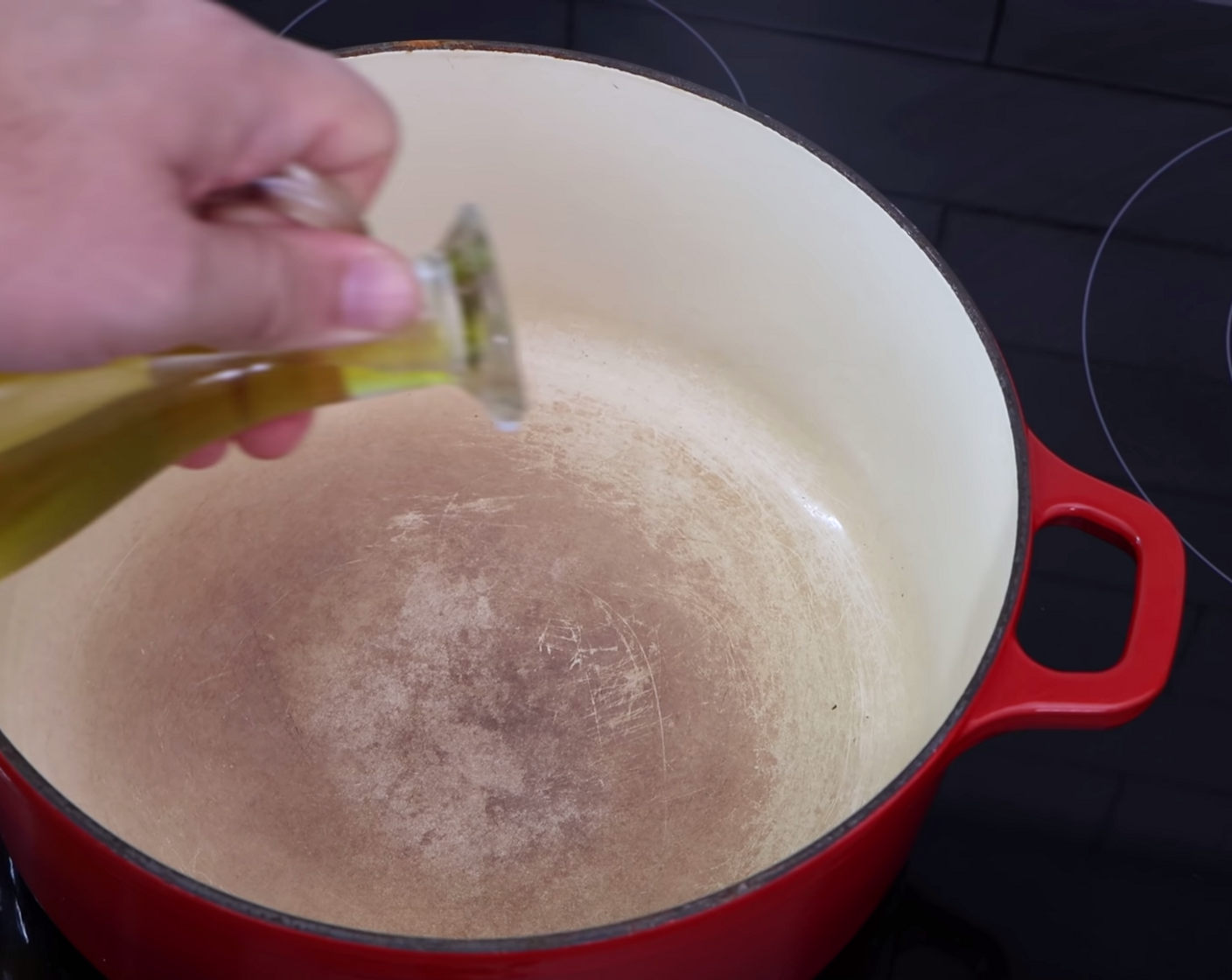 step 3 Place a medium-large size pot on the stove at low-medium heat. Once the pot has started to warm, add 4-5 Tbsp of Extra-Virgin Olive Oil (as needed).