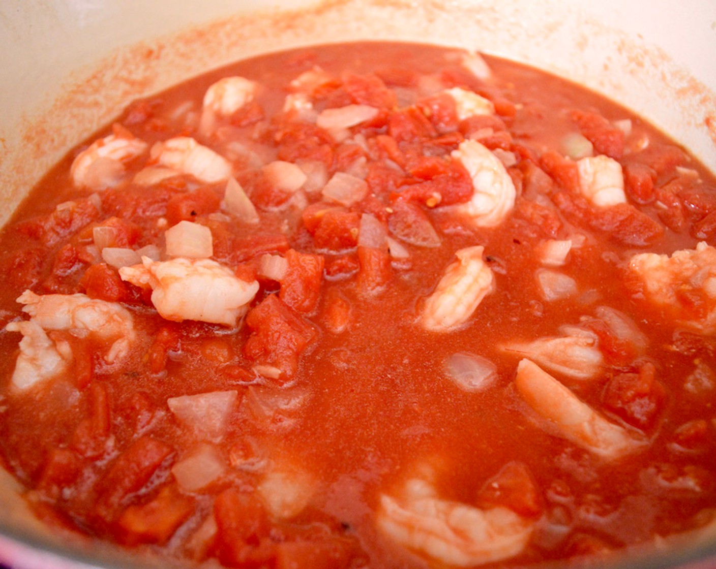 step 4 Pour in Diced Tomatoes (2 cans). Season the mixture generously with Salt (2 pinches) and Crushed Red Pepper Flakes (2 pinches). Let it simmer and thicken for 20 minutes.