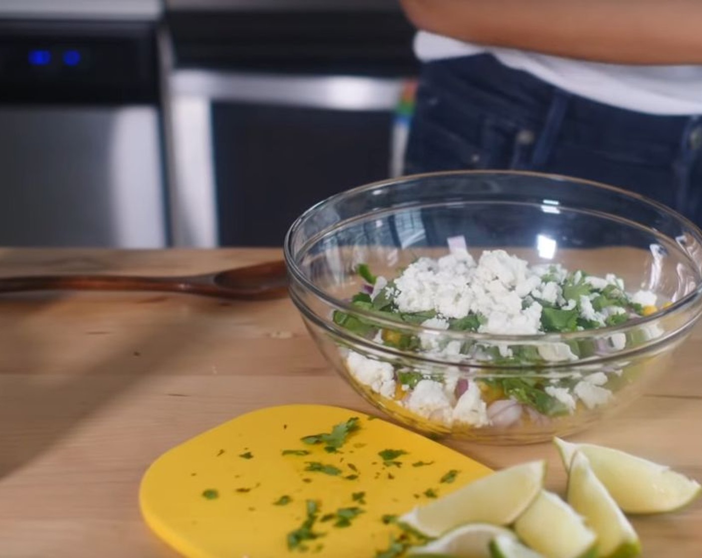 step 2 In your serving bowl, combine the Corn (4 ears), Red Onion (1/2), Fresh Cilantro (4 Tbsp), Vegan Cheese (4 Tbsp), and Chili Powder (1/2 tsp).