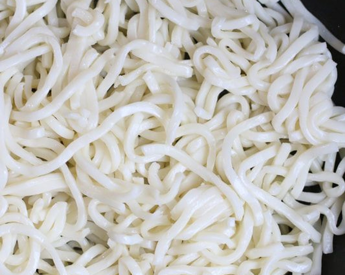 step 5 Add Udon Noodles (8 oz) to the center of the pan.  If you are using fresh udon noodles, they will be “springy” but will become tender as you cook them; if you are using dried noodles that have been cooked and drained, they will already be tender when you place them in your pan. Stir-fry for 2-3 minutes, turning until lightly golden.