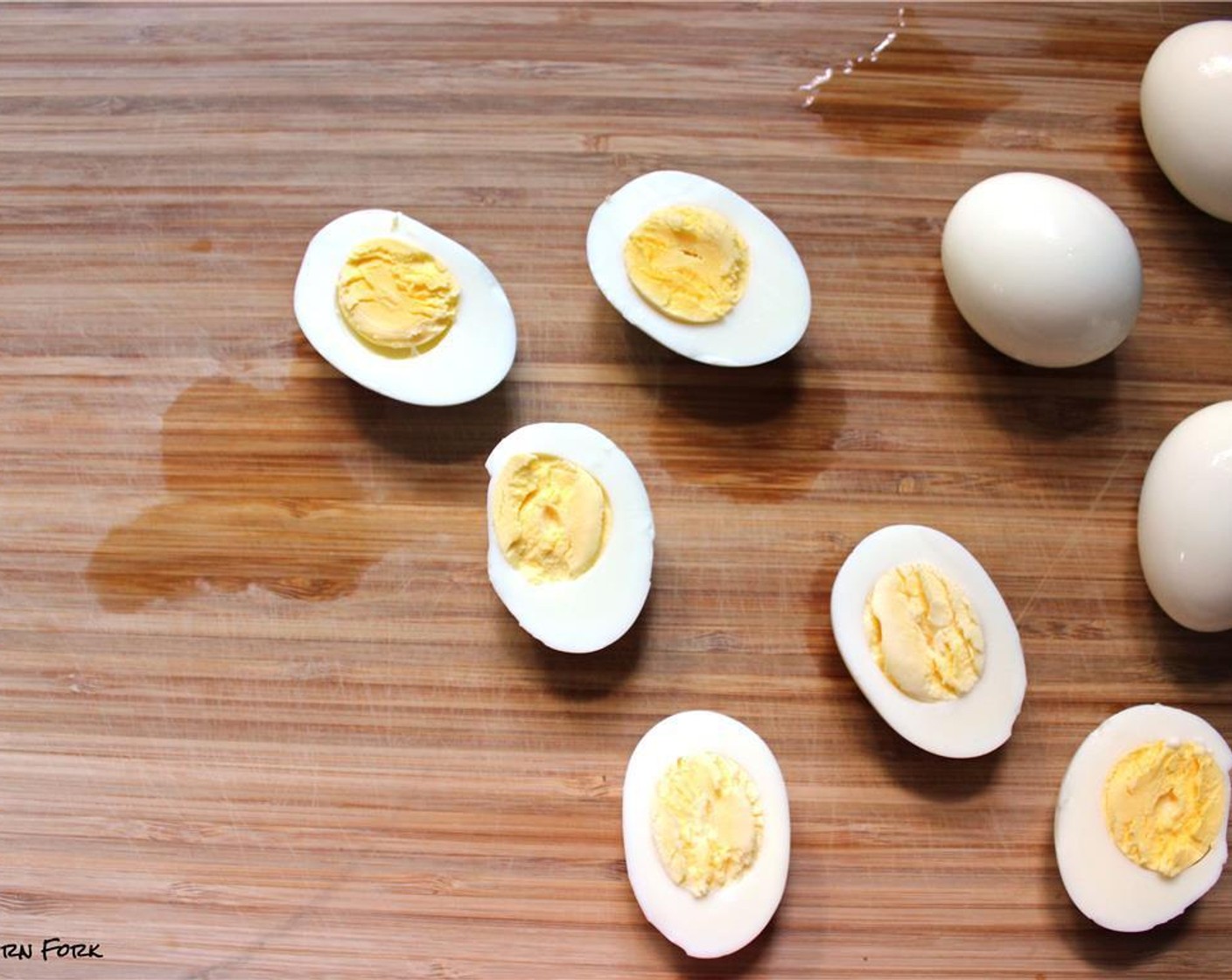 step 4 Peel the eggs, slice in half, and scoop the yolks out into a small bowl.