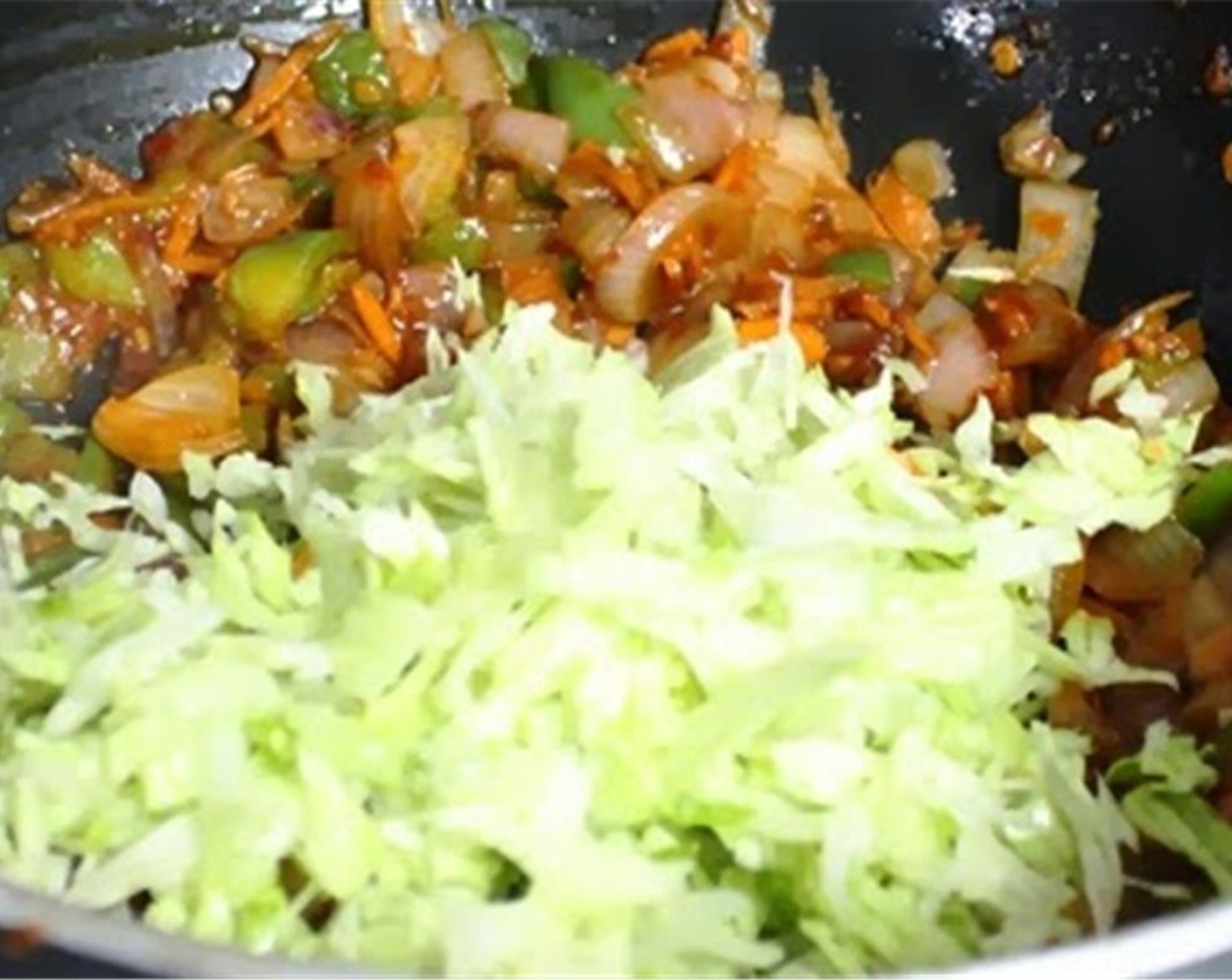 step 7 Add in the Green Cabbage (2 cups). Mix well and fry for 30 seconds - 1 minute. Season with Cane Sugar (1 pinch), Salt (1/2 tsp) and Ground Black Pepper (1 tsp).