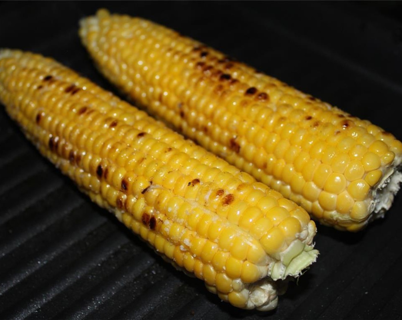 step 6 Heat a grill/grill pan over medium heat. Brush the corn with Olive Oil (1 Tbsp) and season with Salt (to taste). When the grill is hot, add the corn and cook for 10-12 minutes.