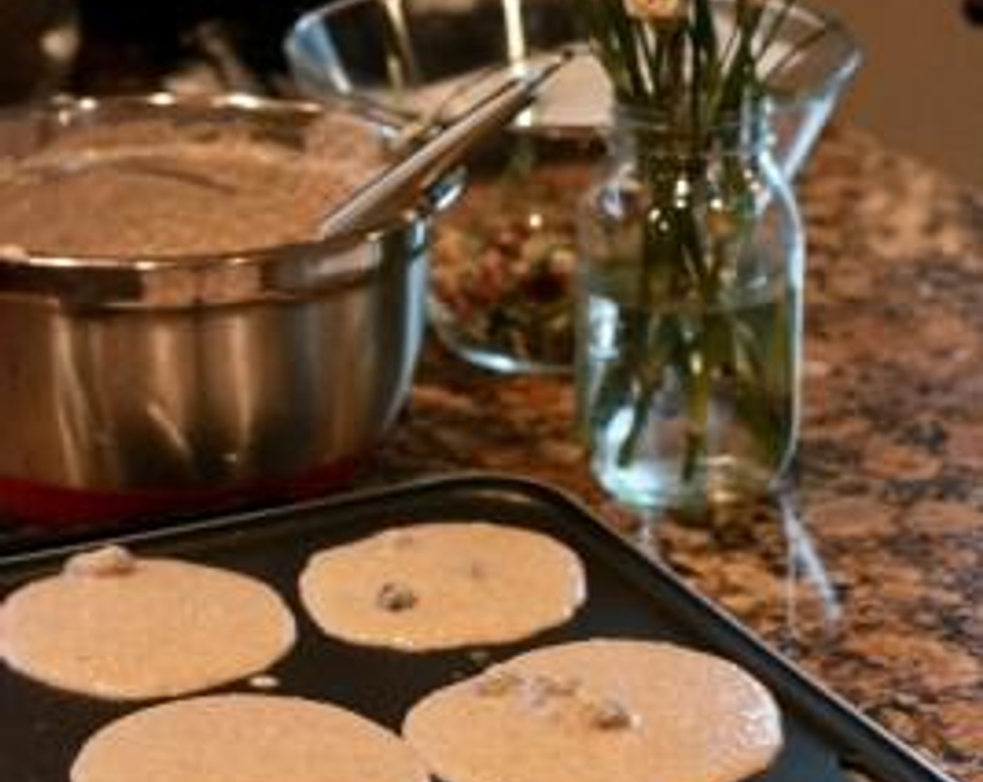 step 3 Use a 1/4-cup measuring cup or small ladle and scoop batter onto a heated griddle sprayed with Nonstick Cooking Spray (as needed).