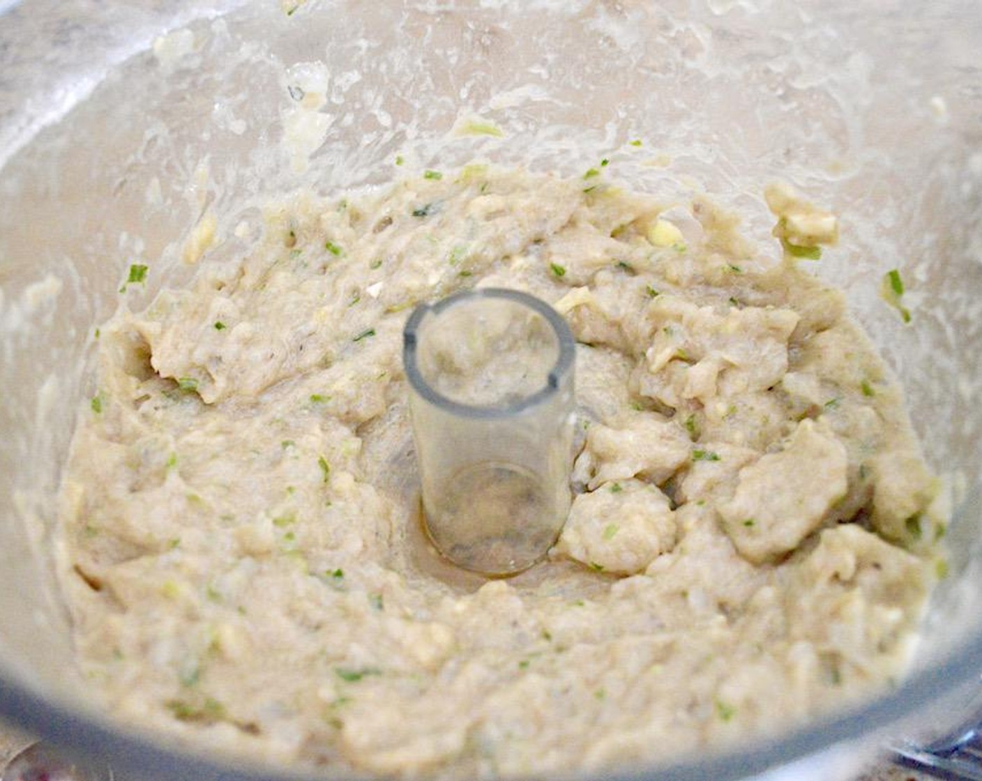 step 1 In a food processor, combine the Large Shrimp (1 lb), Fresh Ginger (1 1/2 Tbsp), Scallion (1 bunch), Soy Sauce (1/2 Tbsp), Sesame Oil (1/2 Tbsp), Eggs (2), and Corn Starch (1 Tbsp). Puree them all together until it is a smooth, thick filling.