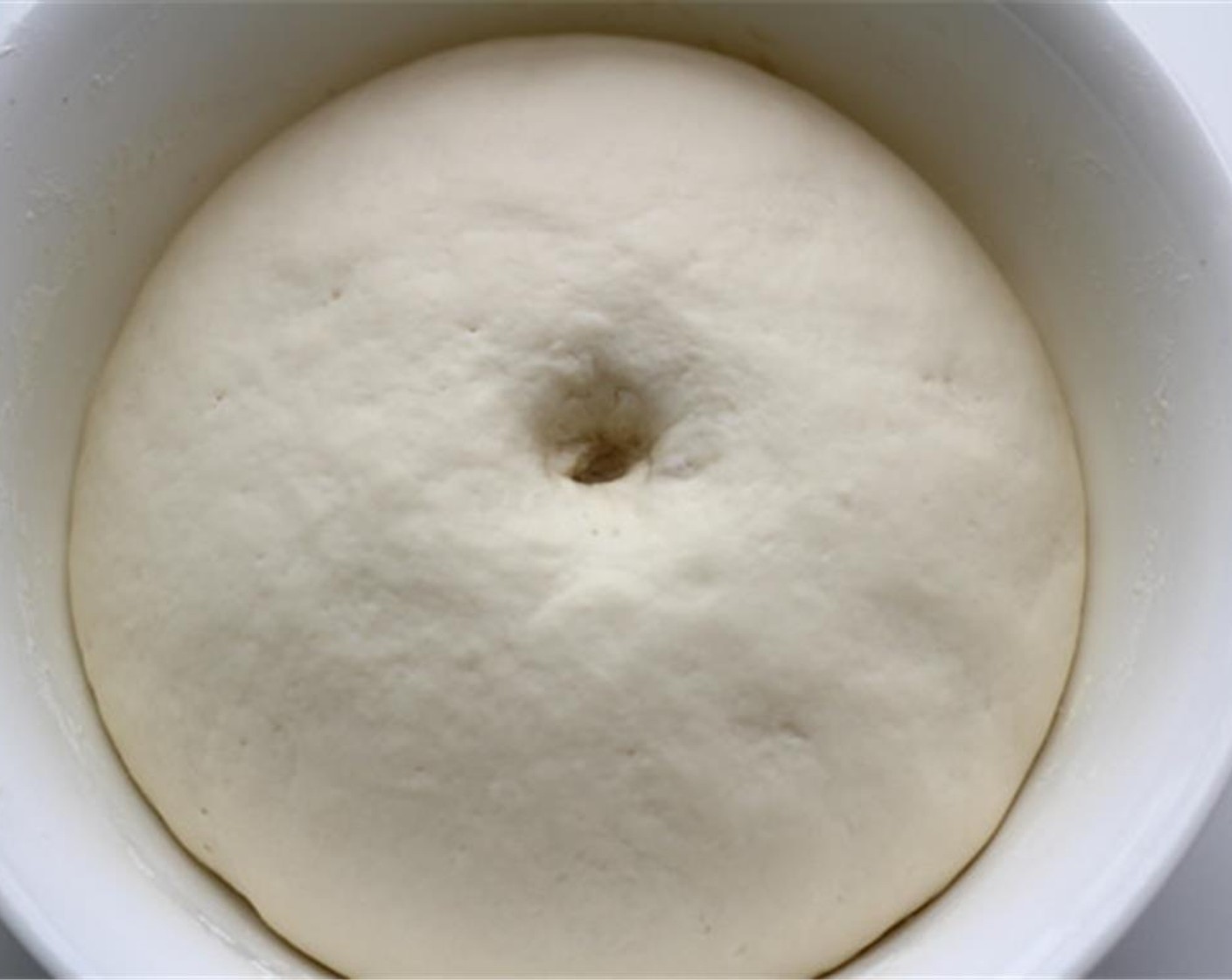 step 4 Cover the bowl and let the dough rest for around 1 hour or until it doubles in size.  Put it in a oven to shorten the time. Preheat the oven to around 35 degrees C (95 degrees F) for fermentation. After 5 minutes, turn the oven off. And leave the bowl in.