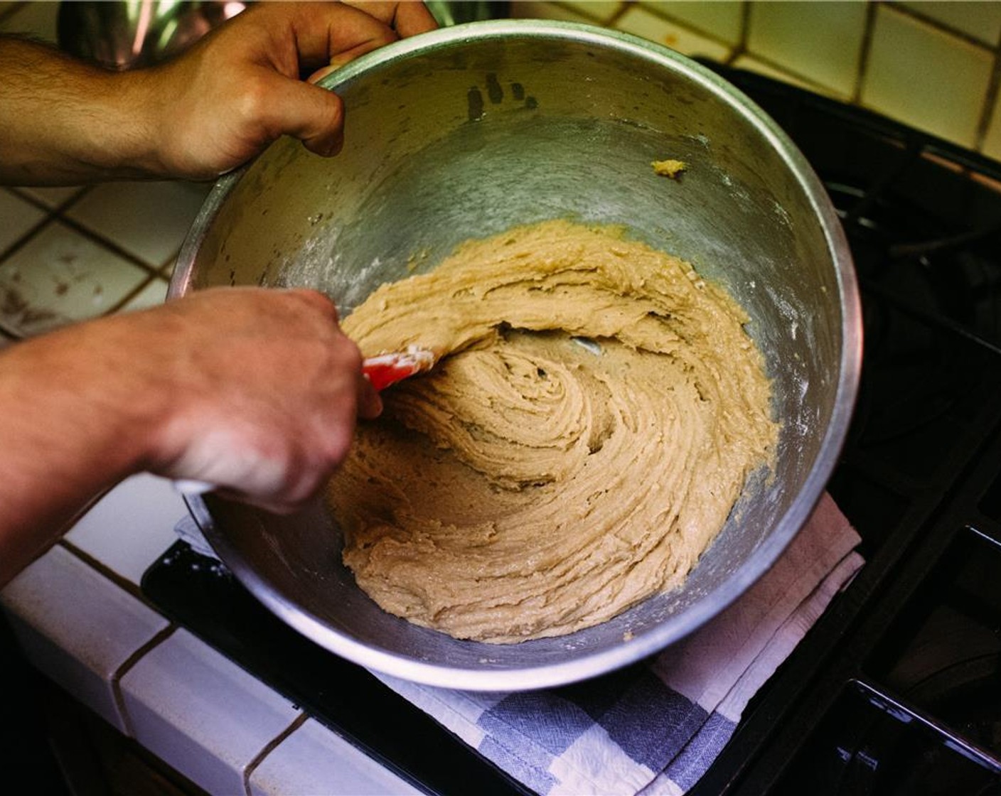 step 5 Add dries, one third at a time, to wets, mixing with a rubber spatula or wooden spoon. Wrap bowl with plastic wrap and chill for at least 20 minutes.