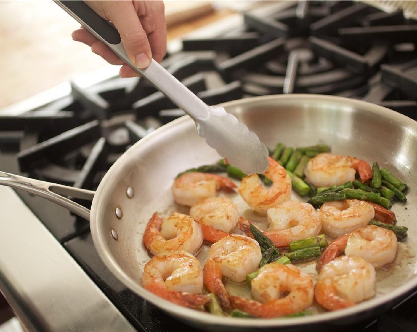 step 8 Using tongs, carefully add the Jumbo Shrimp (12) to the saute pan in a single layer. Add Worcestershire Sauce (1 tsp) and cook shrimp on each side for 1 minute. Remove from heat and hold for plating.