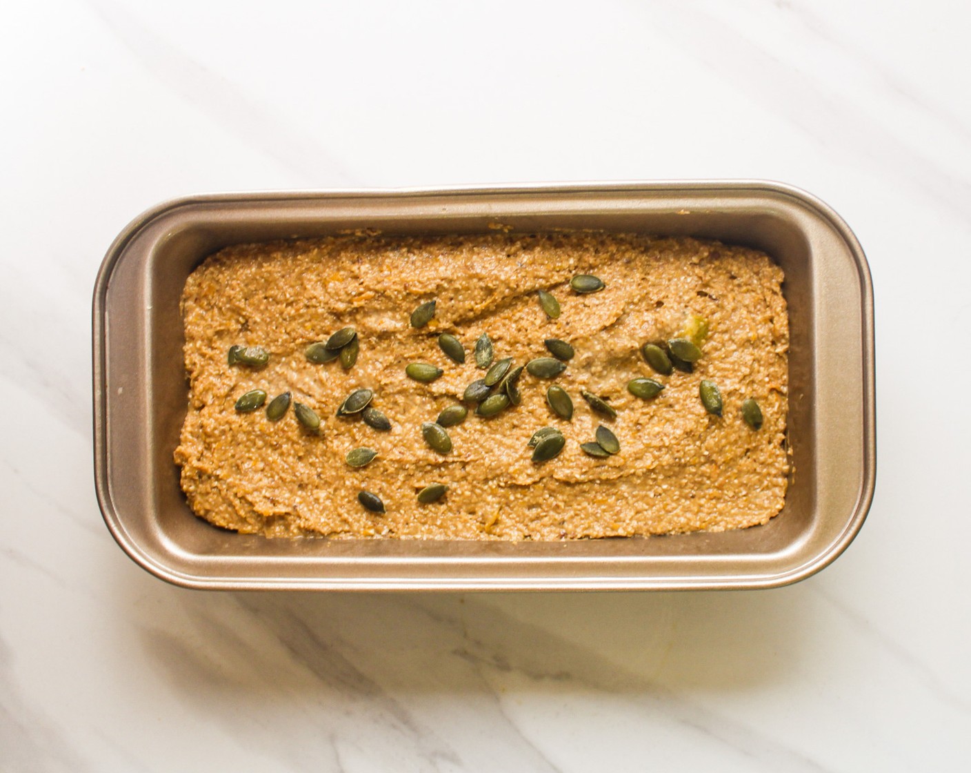 step 7 Transfer the batter to a lined greased 8-inch loaf pan. Bake until the top is golden brown and a toothpick comes out clean, about 40-50 minutes.