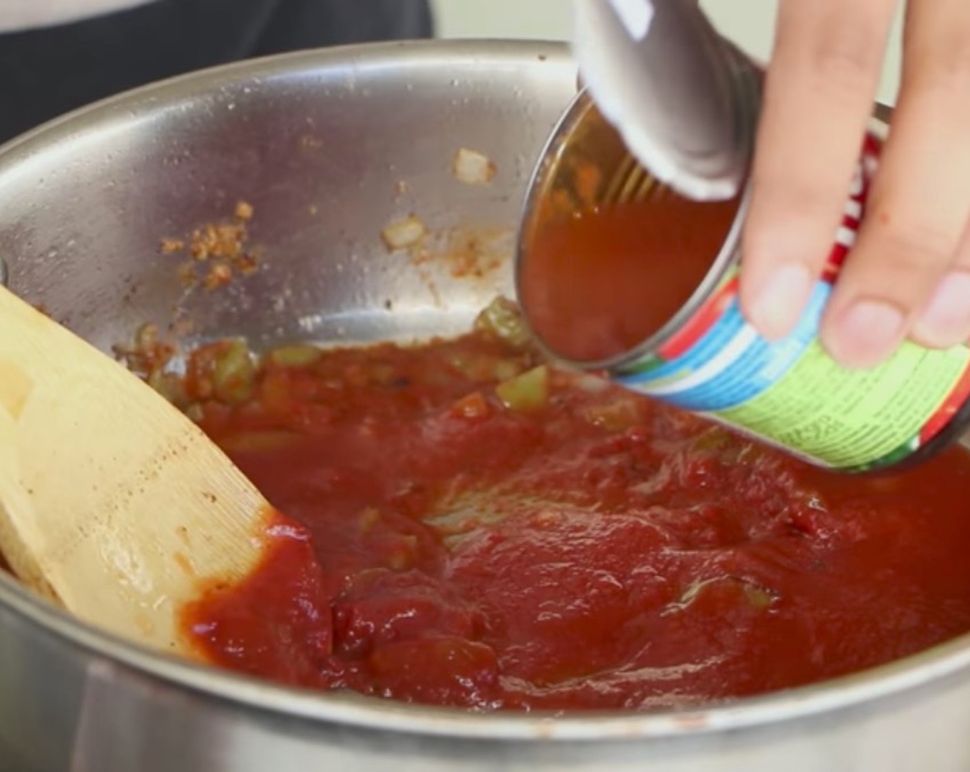 step 7 Add Tomato Paste (2 Tbsp) and Tomato Sauce (1 cup). Fill half the can of tomato sauce with water, give it a whirl and add it in. Then add Manzanilla Olives (8) to the pan.