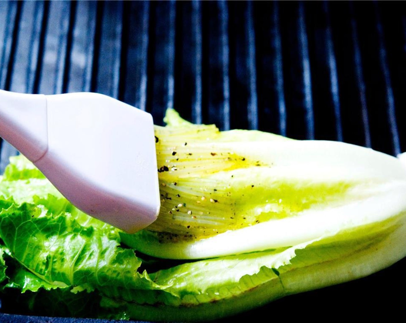 step 7 Brush the remaining dressing on the romaine hearts.