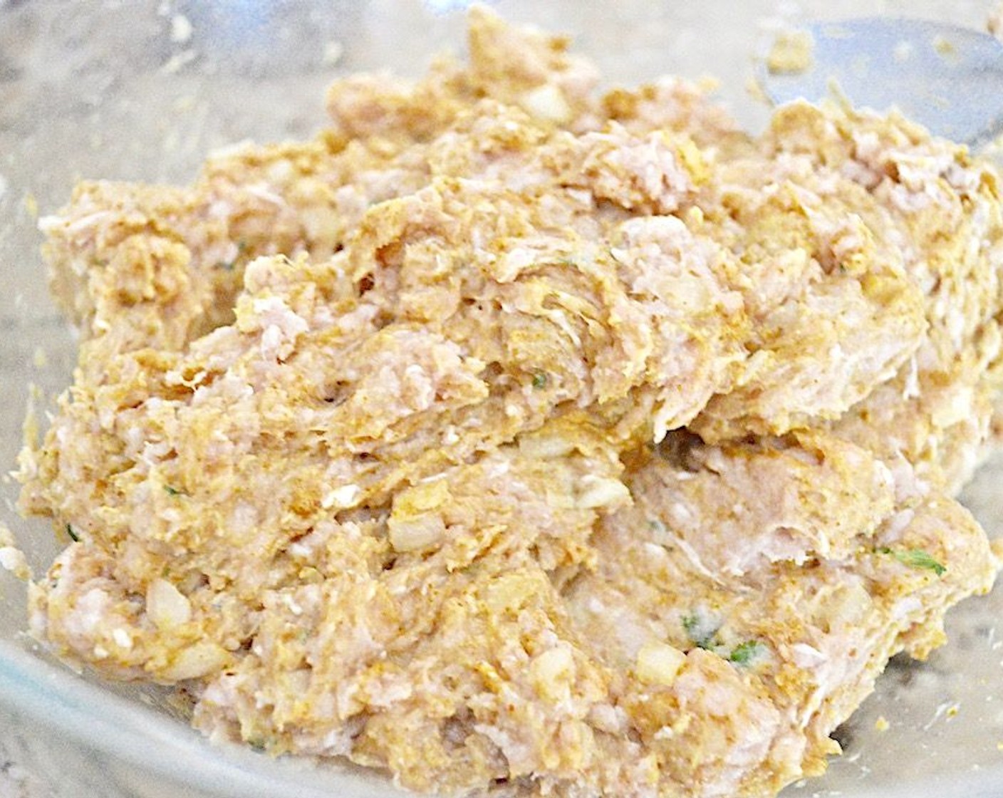 step 2 Combine the Ground Chicken (2 lb), Breadcrumbs (1/2 cup), {@10:}, Curry Powder (2 Tbsp), 1 tablespoon of the Plain Greek Yogurt (1/2 cup), Dijon Mustard (1 Tbsp), Fresh Cilantro (1 Tbsp), Onion (1), McCormick® Garlic Powder (1/2 tsp), Salt (1 pinch), and Ground Black Pepper (1 pinch) in a large mixing bowl. Stir until well combined.