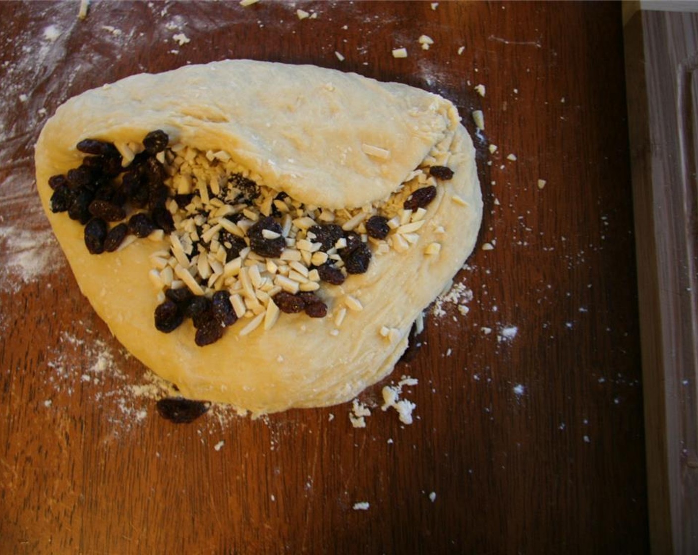 step 6 Kneed in Sun-Maid Raisins (4 Tbsp) and Sliced Almonds (4 Tbsp).