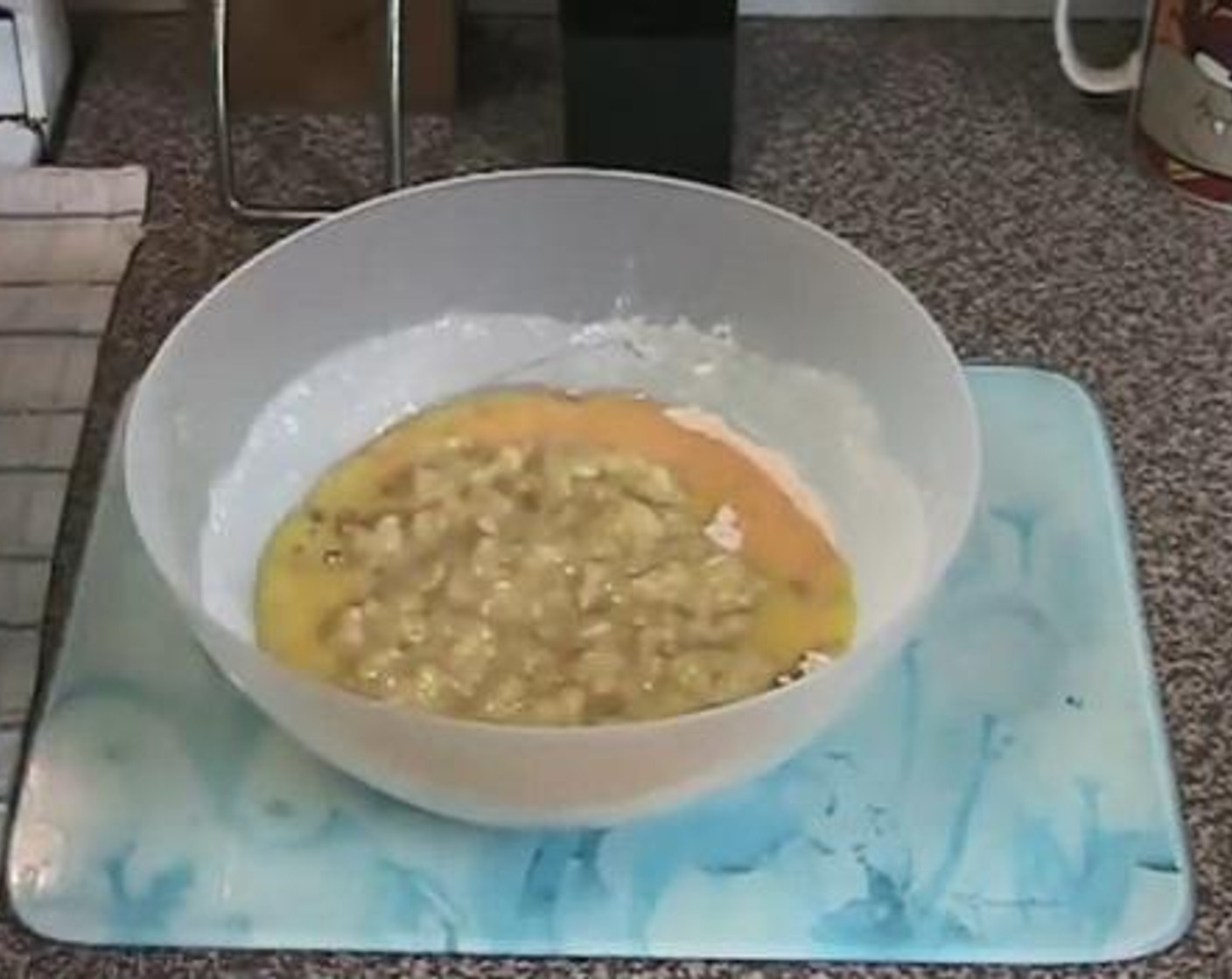 step 2 Add in the melted Butter (1/2 cup), beaten Eggs (2), and diced Bananas (3). Combine everything well.