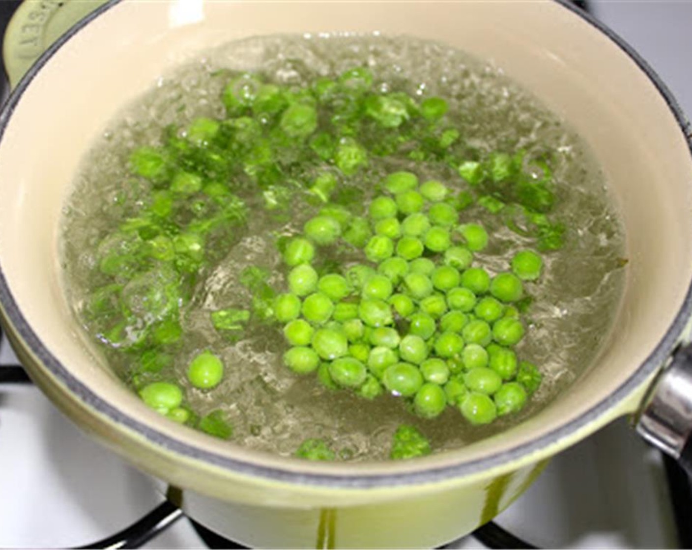 step 2 Start by blanching the  Shelled Fresh Peas (1/2 cup). If you don’t know what blanching is, don’t panic. That’s why I’m here: Bring a small pot of water to a boil. Add the peas and cook for 1 minute.