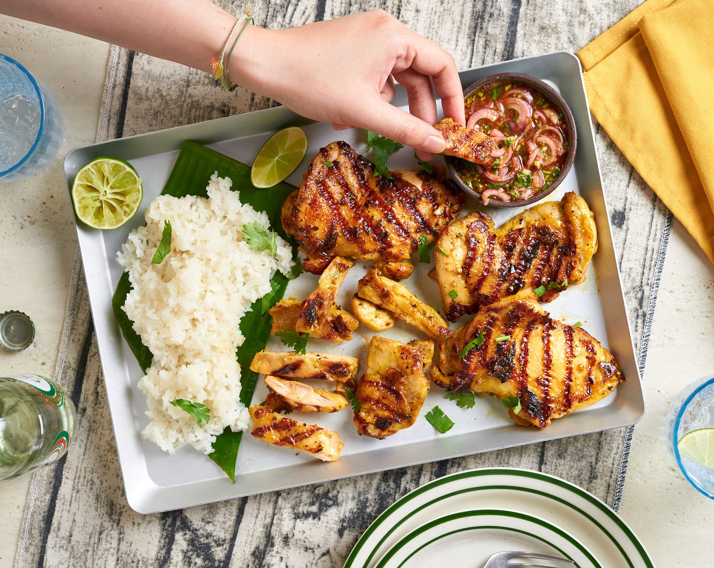 step 5 Slice the grilled chicken and transfer it to a serving platter. Serve with dipping sauce and Glutinous Rice (2 cups).