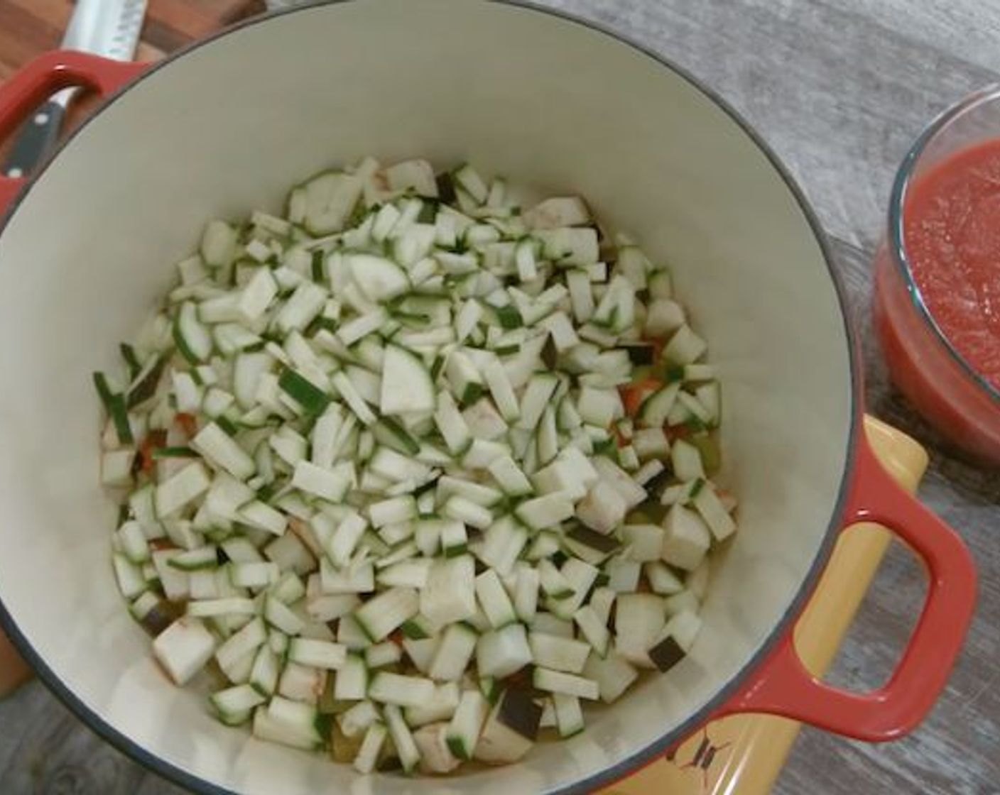 step 8 When the oil is warm add the onion, carrot, celery, zucchini, eggplant and capsicum and stir with a wooden spoon. Cover with the lid and leave to simmer for about 15 minutes but keep stirring every 5 minutes.