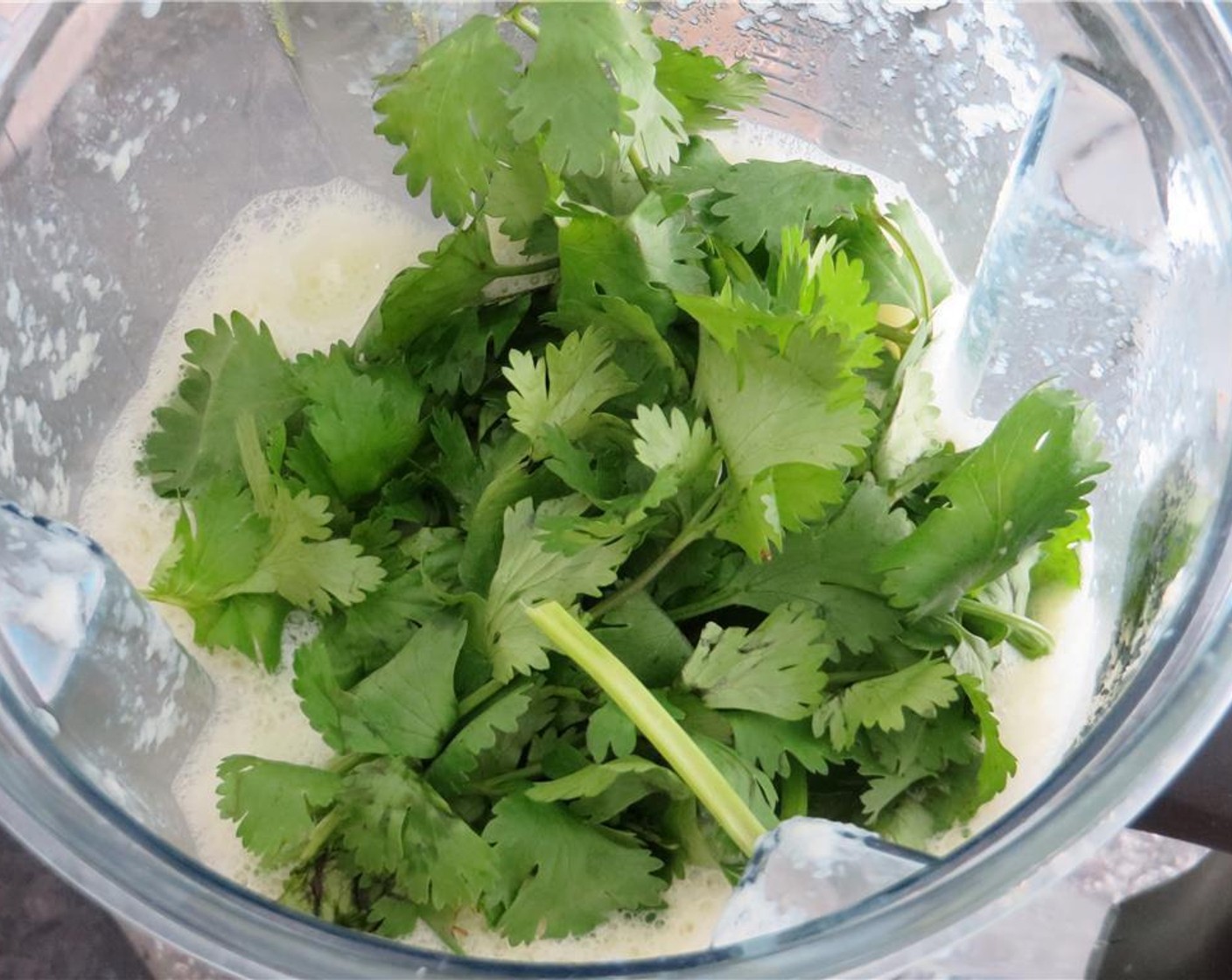 step 1 In a blender, combine the English Cucumbers (2), Fresh Cilantro (1/2 cup), Silken Tofu (8 oz), Vegetable Broth (6 fl oz), Garlic (1 clove), White Wine Vinegar (1/2 Tbsp) and Kosher Salt (1 tsp). Puree until smooth. Refrigerate at least two hours to chill before serving. Season to taste.