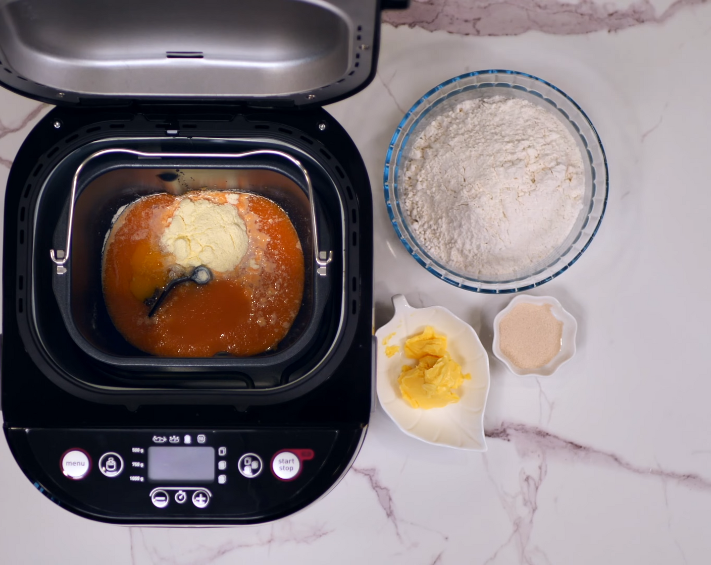 step 2 Place the pumpkin and carrot juice mixture, Eggland's Best Classic Egg (1), Milk Powder (2 Tbsp), Granulated Sugar (2 Tbsp), Bread Flour (2 1/3 cups), Instant Dry Yeast (1 tsp), and Salted Butter (2 Tbsp) into a breadmaker.
