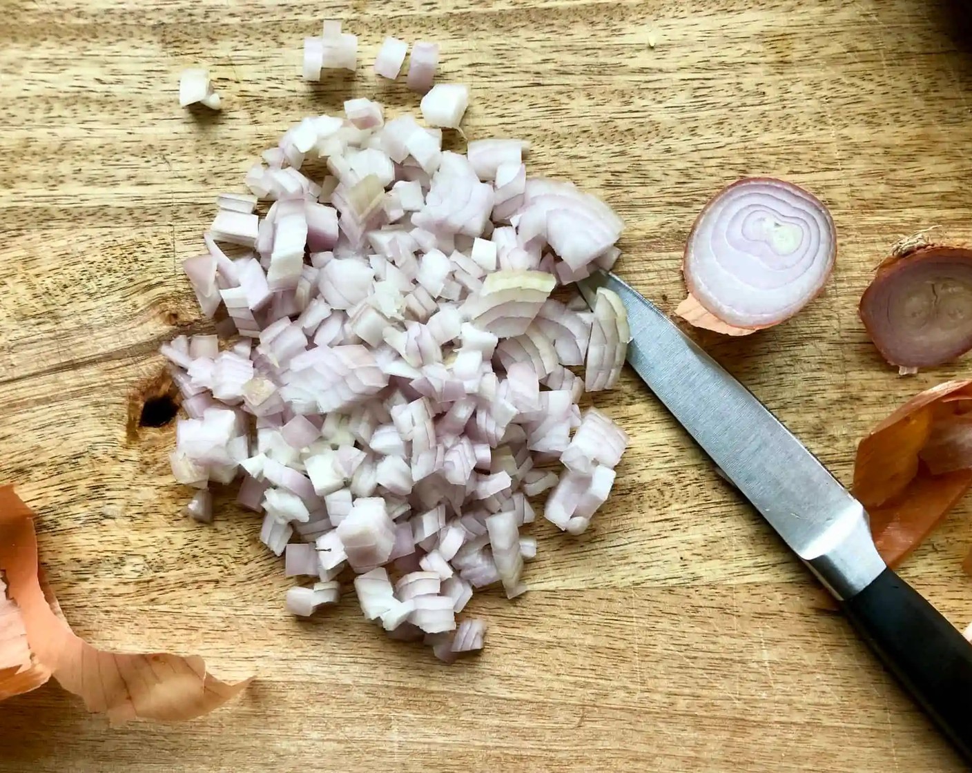 step 2 Heat Sesame Oil (2 Tbsp) in a large skillet over medium-high heat. When the oil shimmers, add the Shallots (2) and cook until fragrant and lightly caramelized for about 2 minutes.