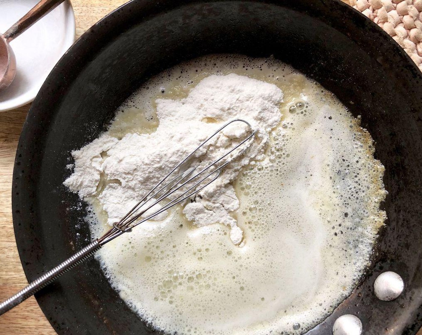 step 3 Meanwhile, melt Unsalted Butter (3 Tbsp) in a small saucepan over low-medium heat. Add the All-Purpose Flour (3 Tbsp) and whisk continuously until mixture is smooth and golden in color. Add a small amount (about 1 cup) of the simmered broth to the roux, a little bit at a time while continuously whisking.