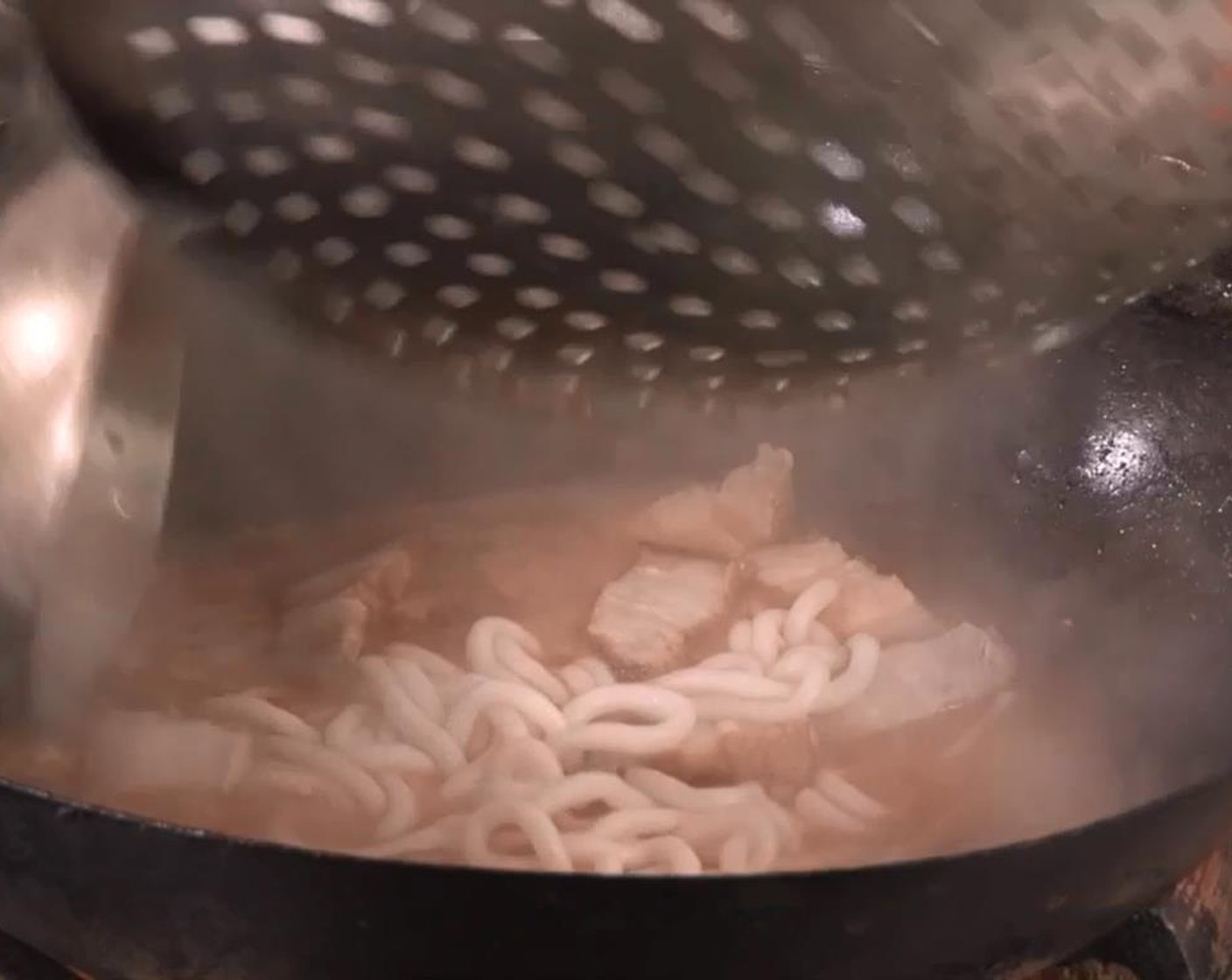 step 4 Add potato noodles, pea shoots and Macao roast pork into the pot. Season with a bit of Ground White Pepper (to taste) and Chili Oil (1/2 Tbsp).