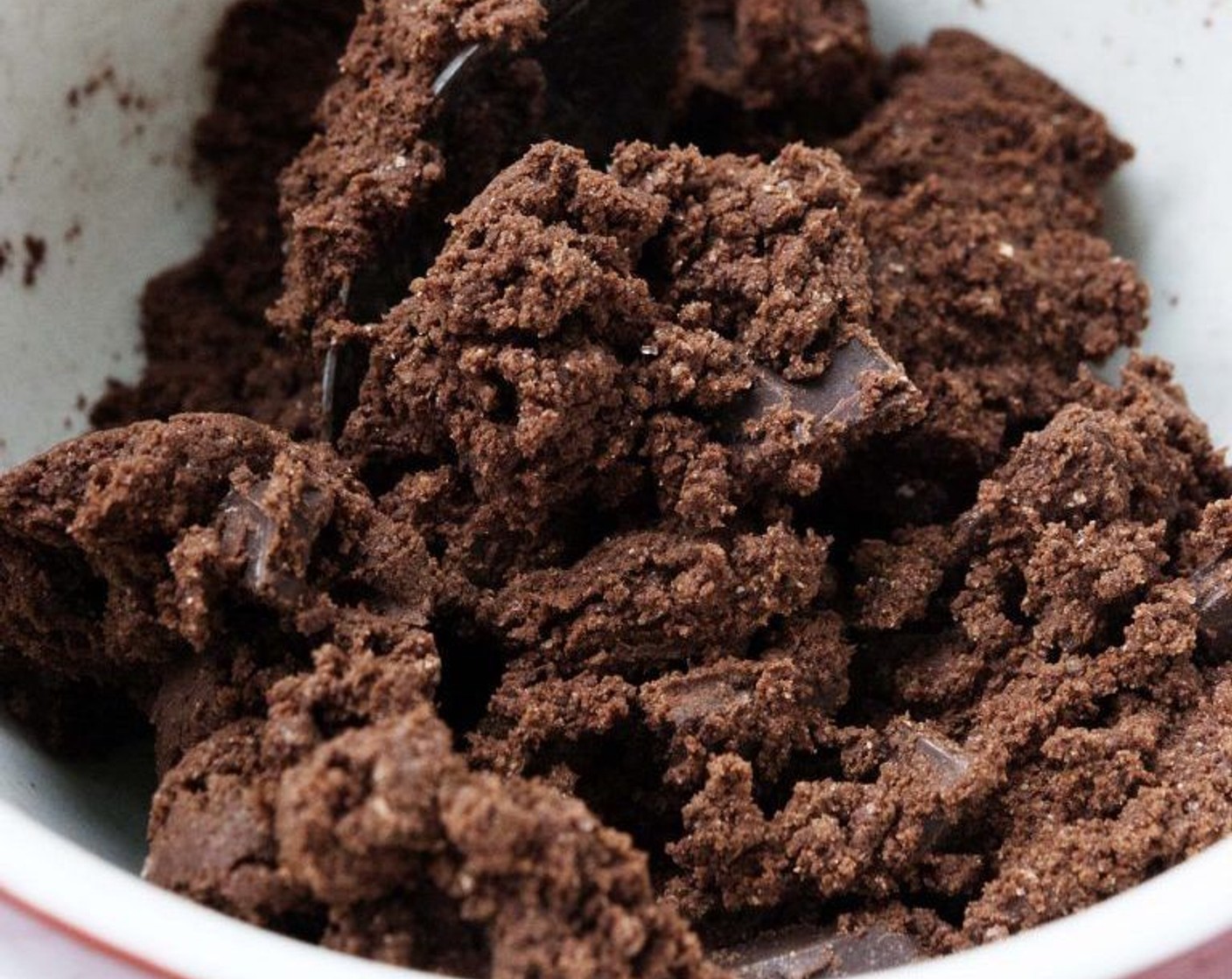 step 4 In a separate bowl, stir Spelt Flour (1 cup), Cacao Powder (1/3 cup), Coconut Sugar (1/3 cup), Baking Powder (1/4 tsp) and Salt (1/4 tsp) together and pour in the wet ingredients. Add the Vegan Chocolate Chips (to taste) and mix to form the dough.