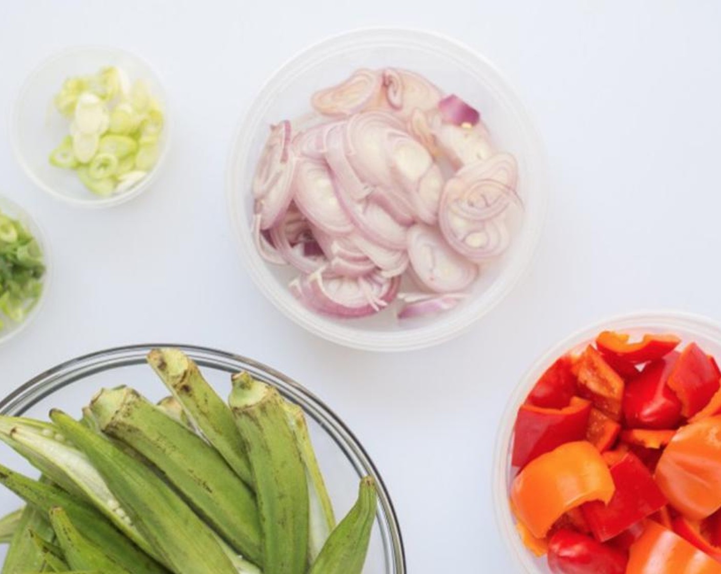 step 2 Prepare your mise en place: Halve Okra (2 1/4 cups) lengthwise. Remove stem and seeds from Bell Peppers (1 1/3 cups); cut into 1-inch pieces.