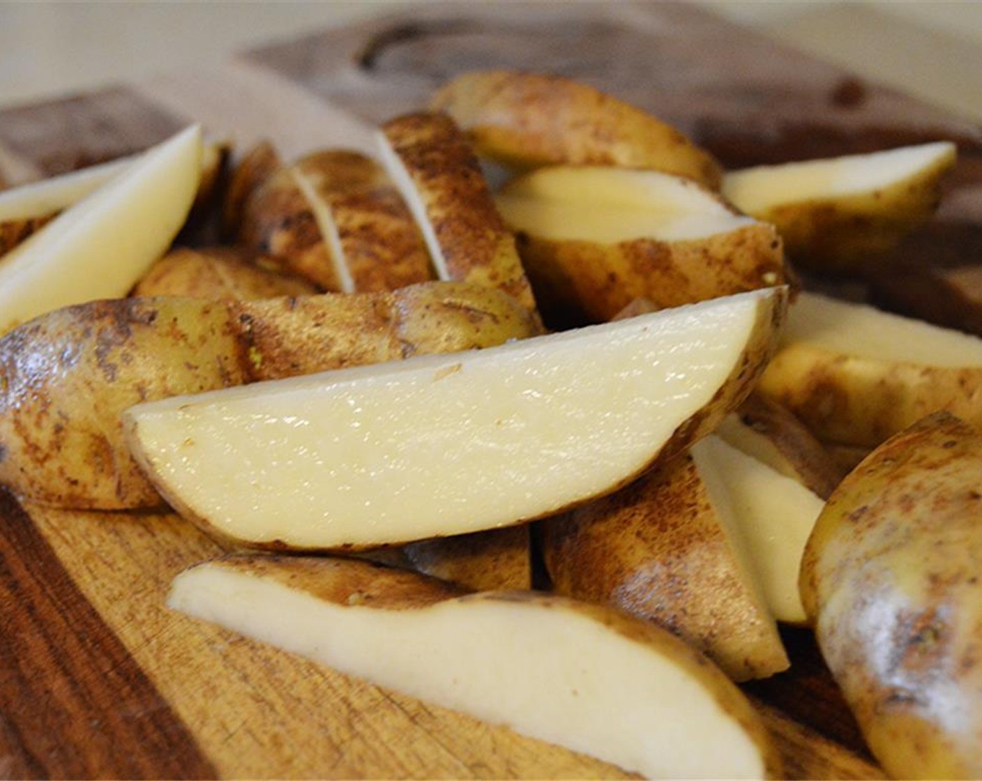 step 1 Wash, dry and cut Potatoes (4) into wedges, leaving the skin on.