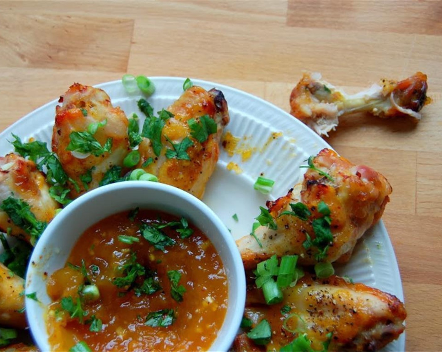 step 6 You want the chicken to be fall off the bone tender, so turn the oven down to 350 degrees F (180 degrees C) and place wings back into the oven to reach desired tenderness, about 15 minutes.