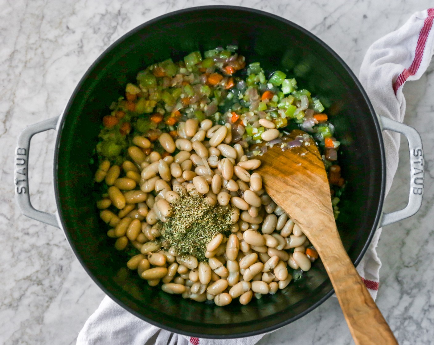 step 4 Add in the Italian Seasoning (1 Tbsp) and Cannellini White Kidney Beans (2 cans), and stir to combine.