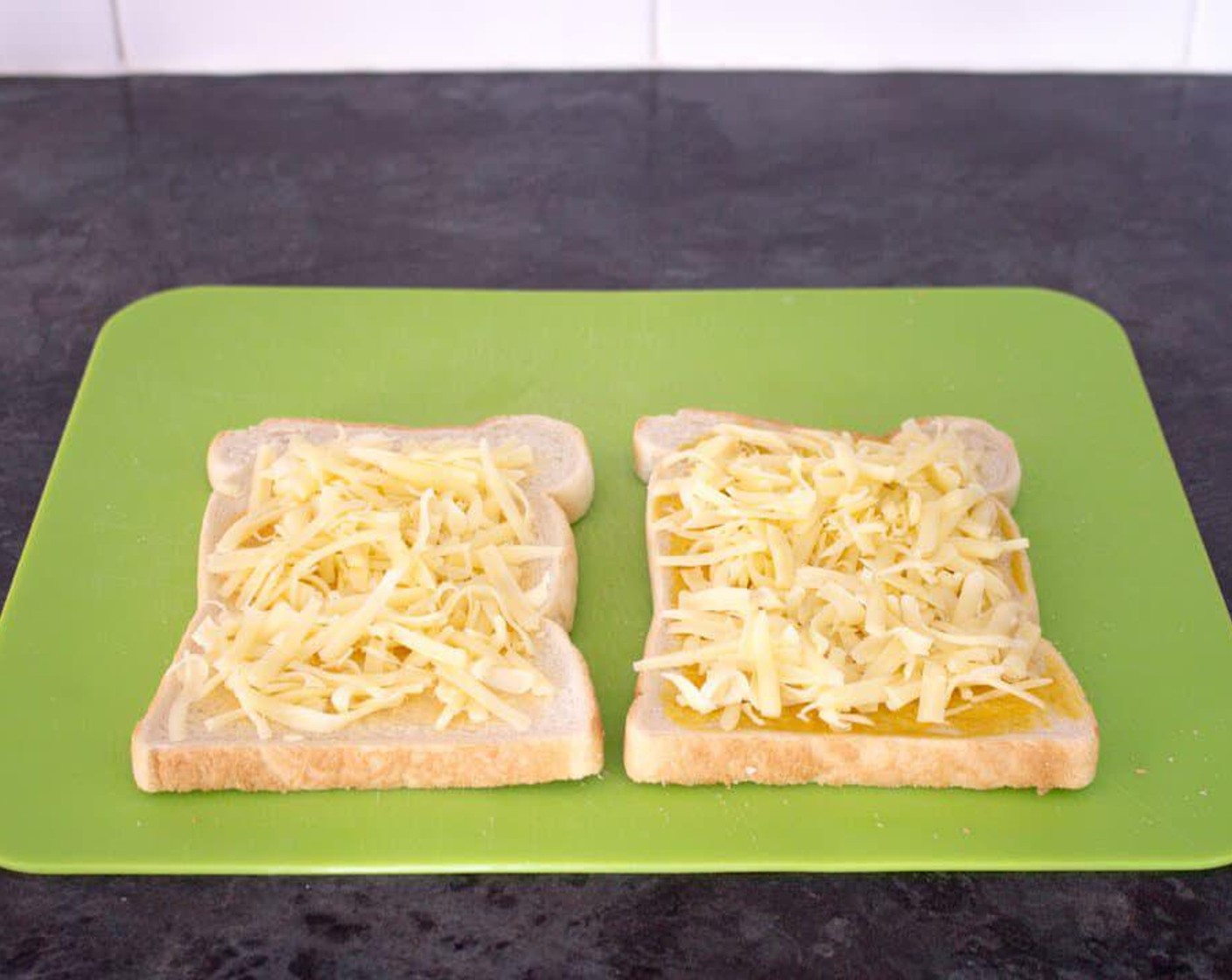 step 7 Now top both slices with Cheddar Cheese (1/2 cup), reserving a little for the top.
