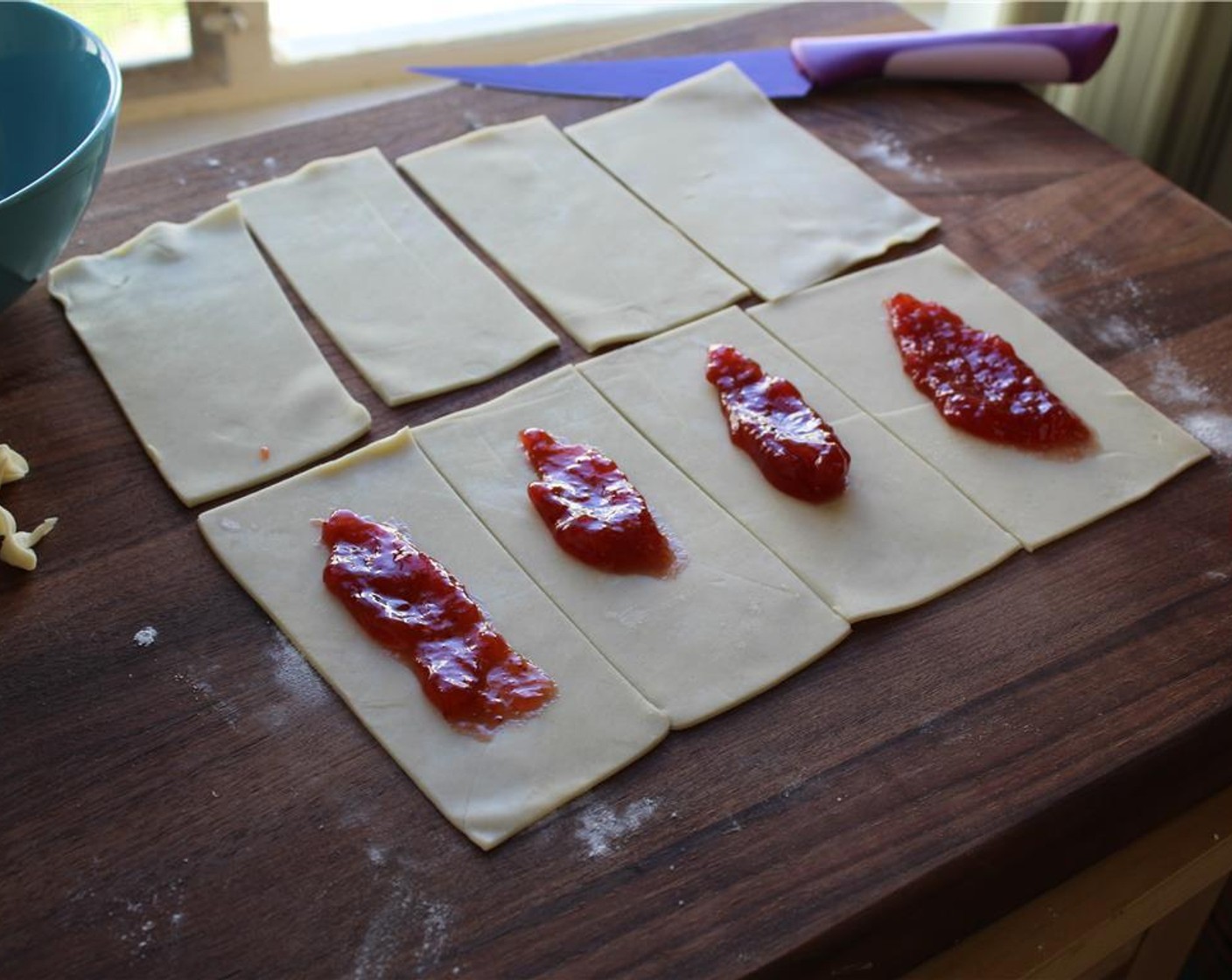 step 4 Smear about 2 tablespoons Strawberry Preserves (1 cup) in the center of 4 of the rectangles.