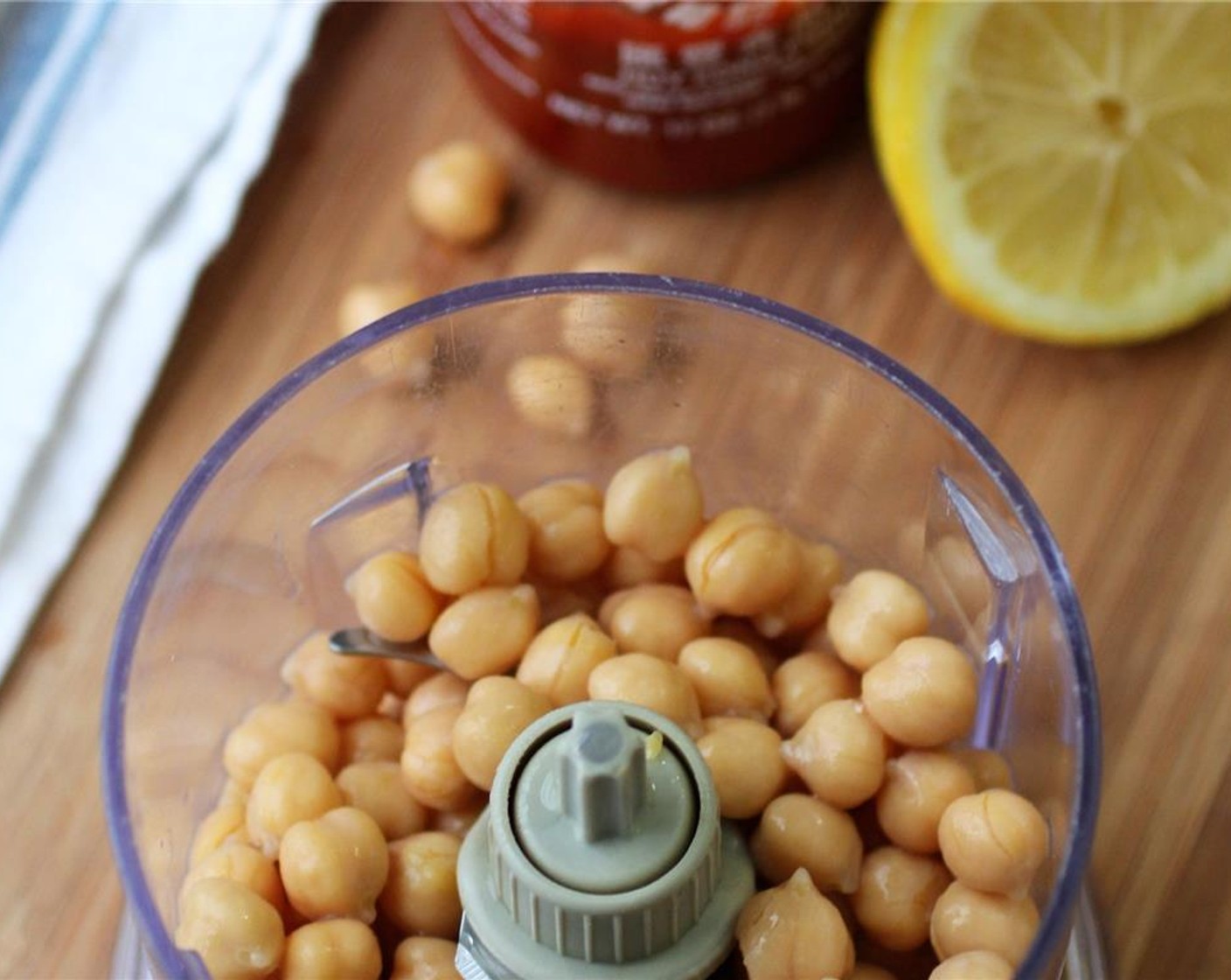 step 1 Juice the Lemon (1/2) and reserve. Drain the GOYA® Chick Peas (2 cups) and reserve 2 1/2 tablespoons of chickpea can water.