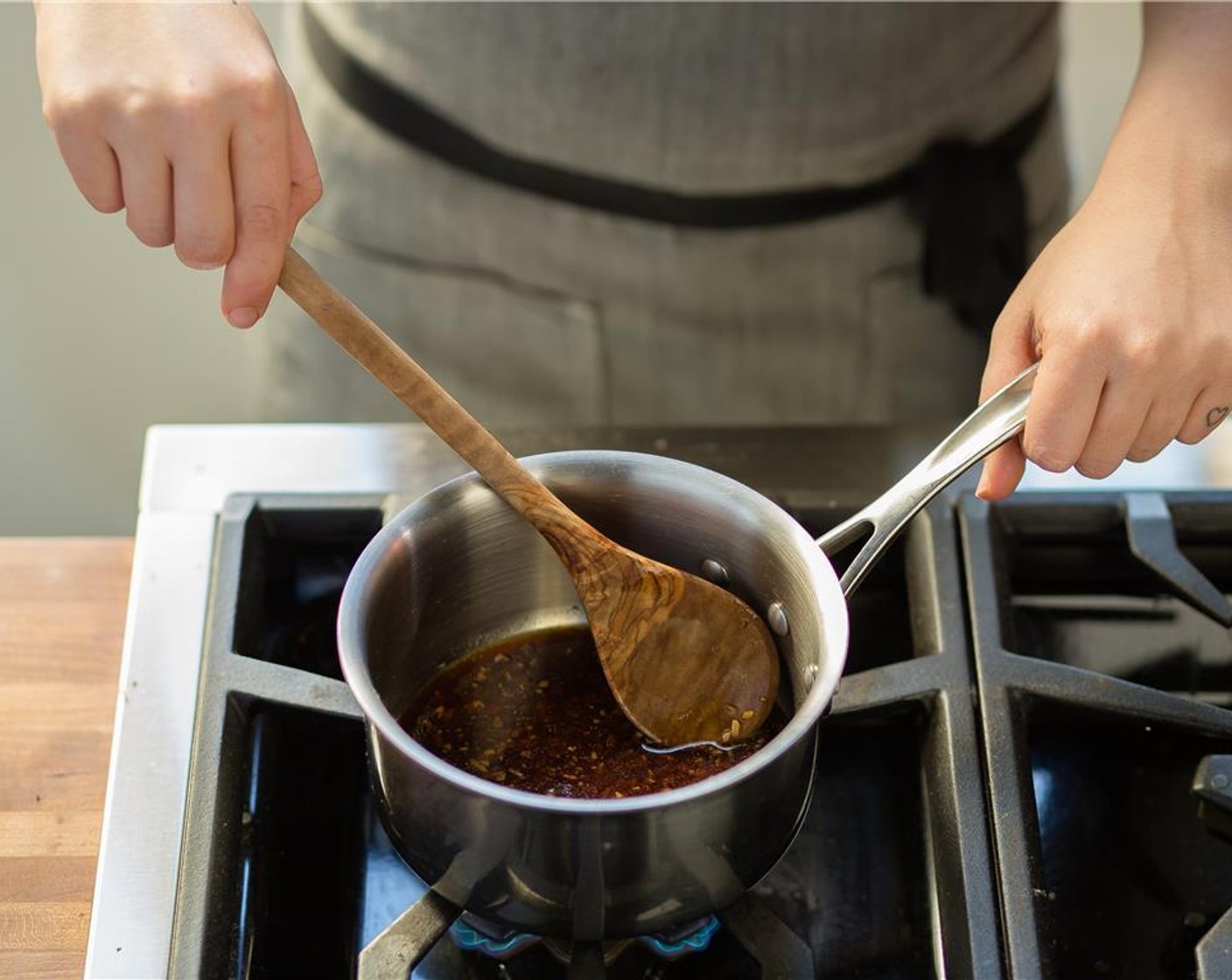 step 8 In a small saucepan over medium heat, add Tamari Soy Sauce (2 Tbsp), garlic, ginger, Sesame Oil (1/2 tsp) and Crushed Red Pepper Flakes (1/4 tsp).