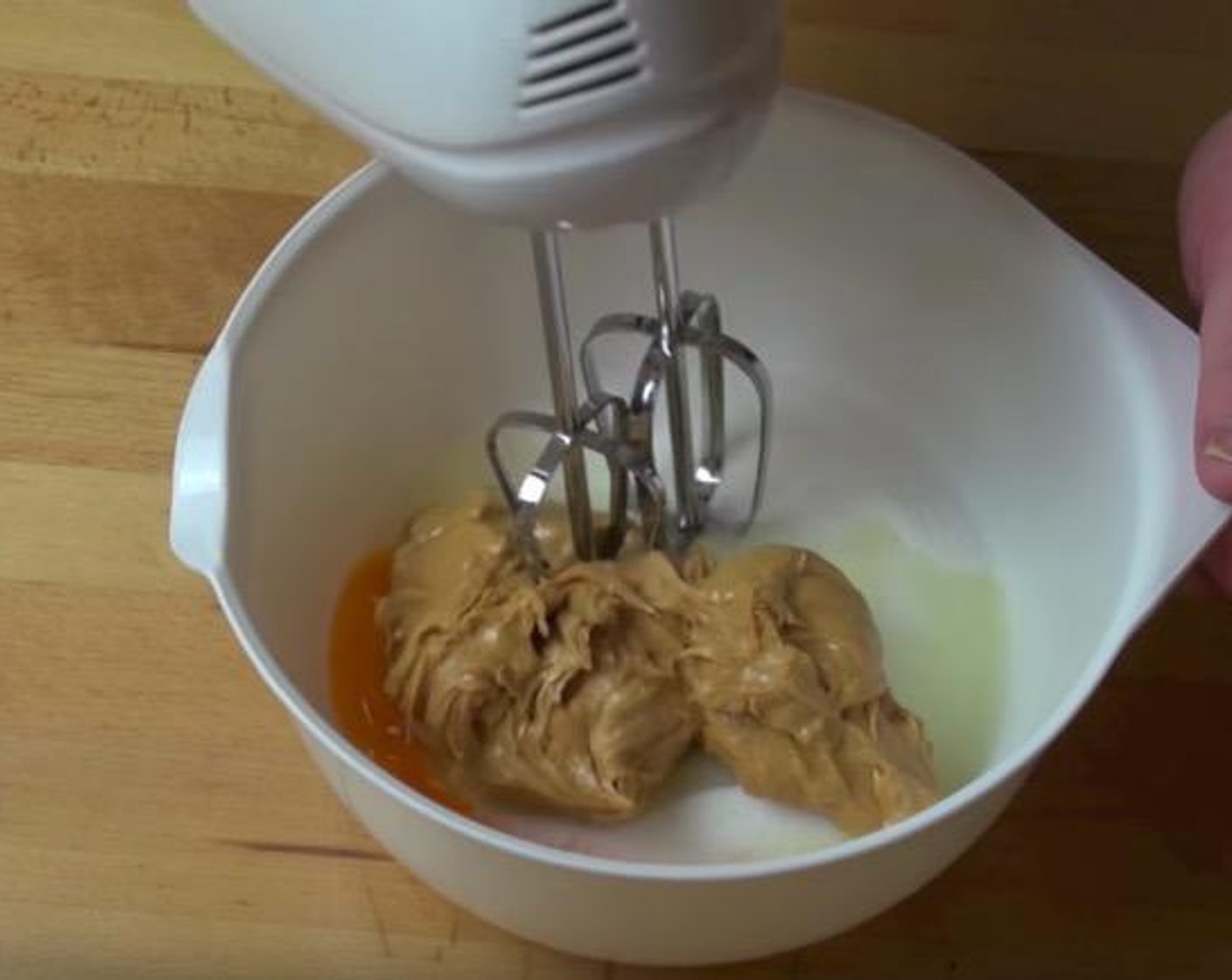 step 1 Put Caster Sugar (1 cup), Egg (1) and Peanut Butter (1 cup) into a mixing bowl. Use an electric mixer to beat everything together until it's combined and smooth.