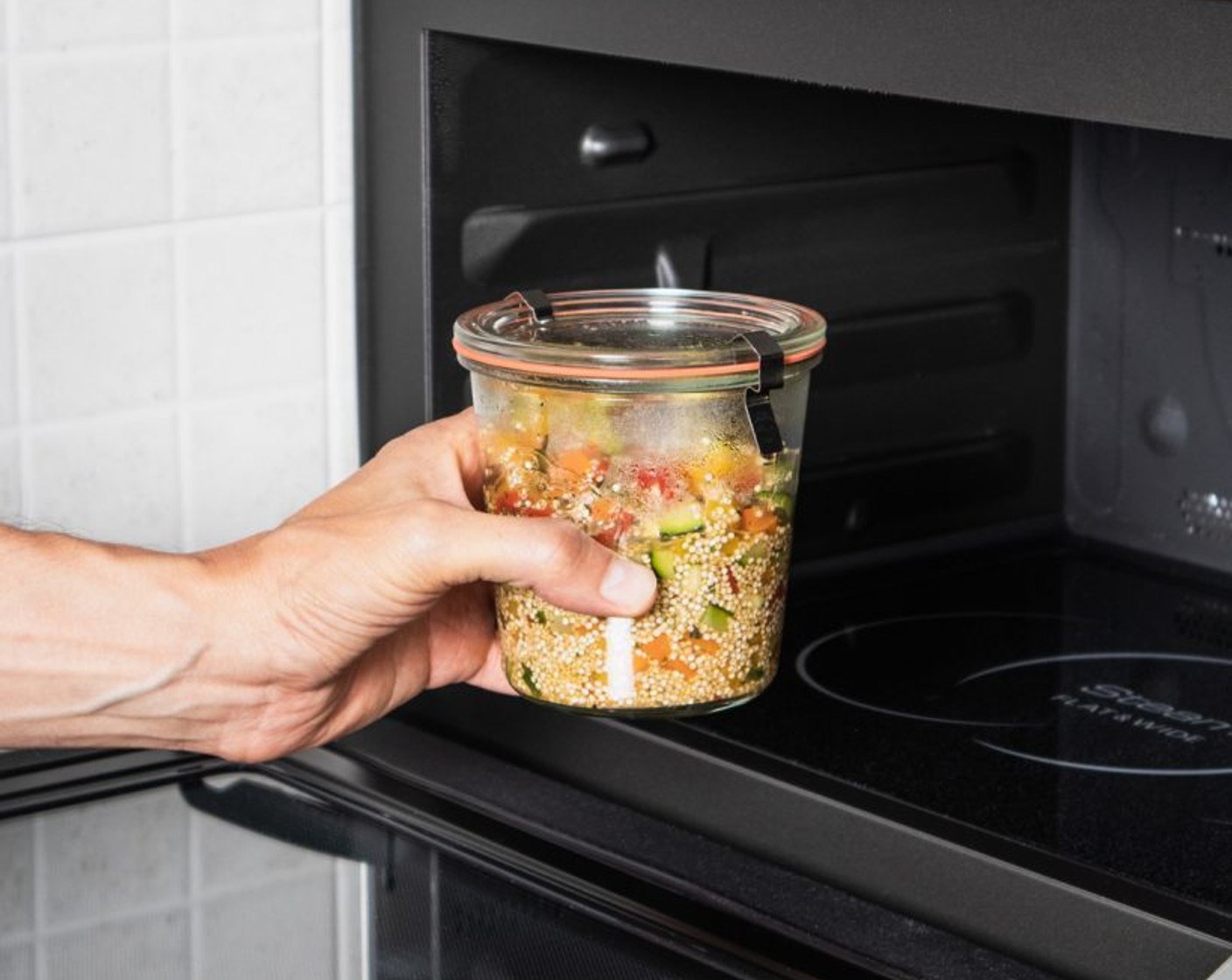 step 4 Insert the jars one at a time in the microwave, set the power to 600 W for 12 minutes.