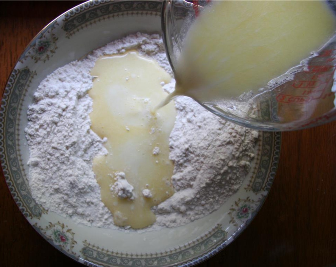 step 4 Add Milk (1/2 cup) and Butter (1/4 cup) to flour mixture and stir until combined.