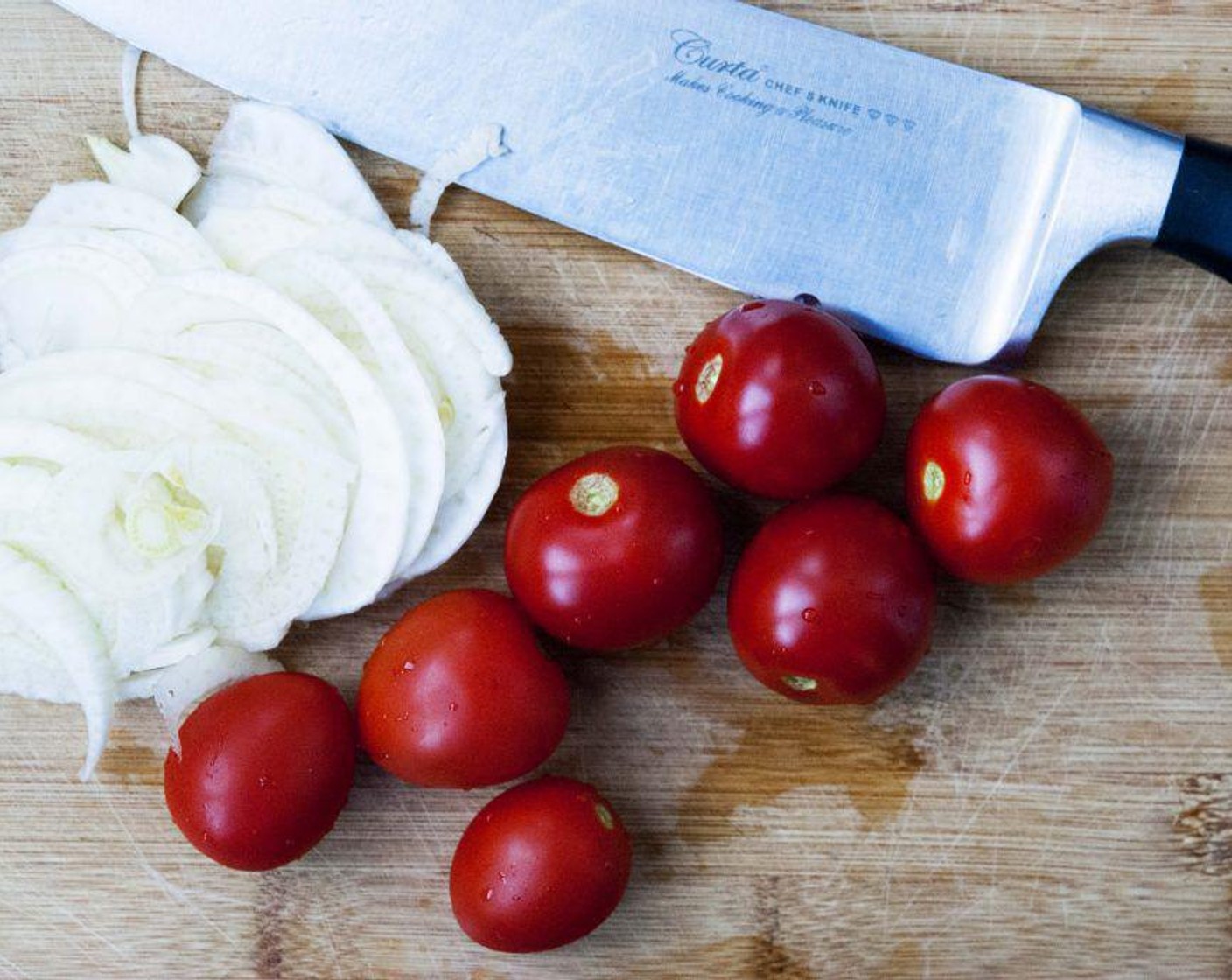 step 2 Wash the Cherry Tomatoes (5)  and slice up the Fennel Bulb (1 bulb) Rinse under water