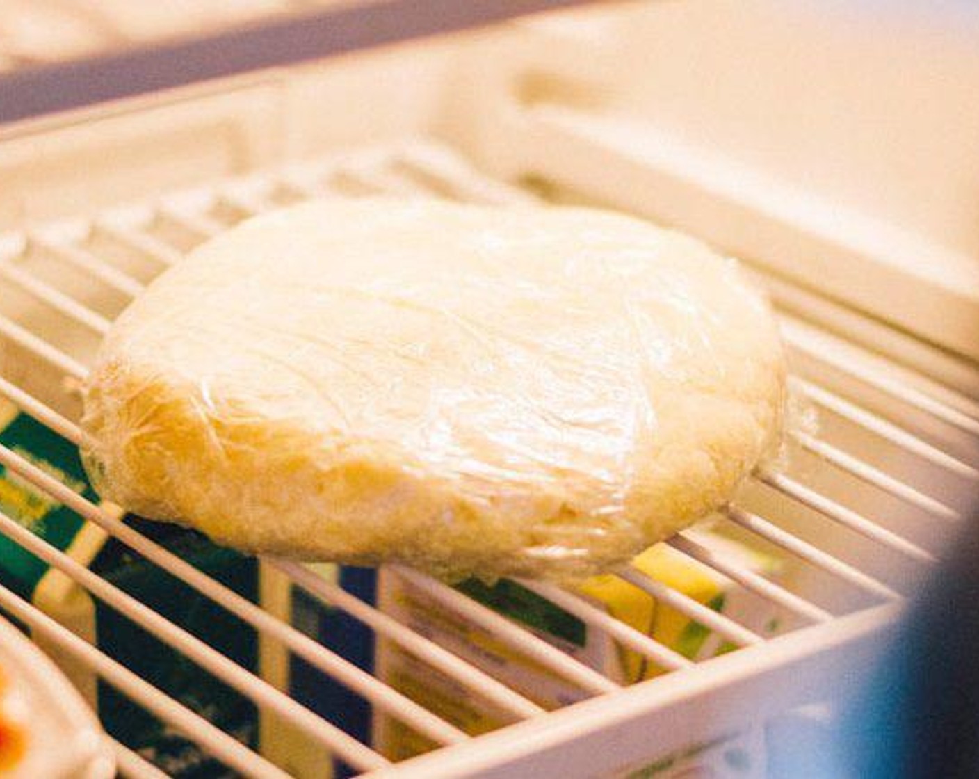 step 1 In a large bowl, mix All-Purpose Flour (2 1/3 cups) and Salt (1/2 tsp). With a pastry cutter or forks, mix Unsalted Butter (3/4 cup) and Shredded Gouda Cheese (1/4 cup) into flour until dough is crumbly and pea-like. Add Water (1/4 cup) one tablespoon at a time, just until dough holds together. Shape dough into a ball, wrap loosely in plastic, and flatten gently with a rolling pin to form a thick, pancake-like disc. Set plastic-wrapped dough in fridge to chill for thirty minutes.