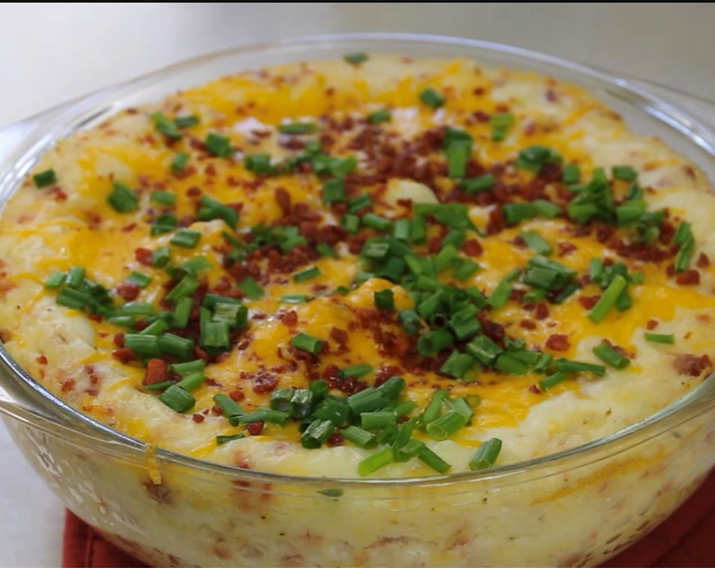step 7 Top with remaining Cheddar Cheese (1/2 cup), Bacon (4 slices), and Scallion (1/2 bunch). Bake 5 more minutes to melt cheese. Serve and enjoy!