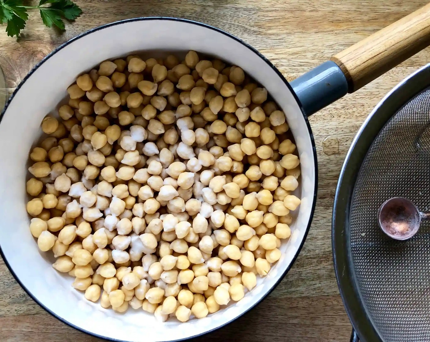 step 2 The next day, drain the chickpeas. Place a medium saucepan or pot over high heat. Add the drained chickpeas and Baking Soda (1 tsp). Cook for about three minutes, stirring constantly.
