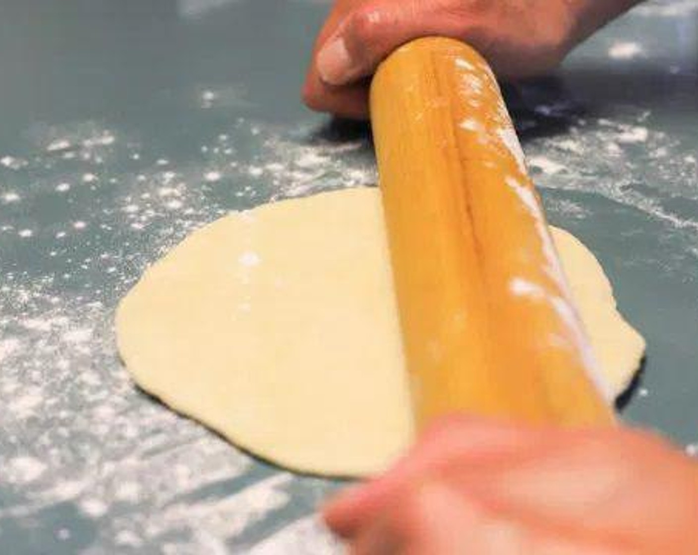 step 5 Roll each ball into a round tortilla (about 10-12 inch diameter) with a rolling pin.