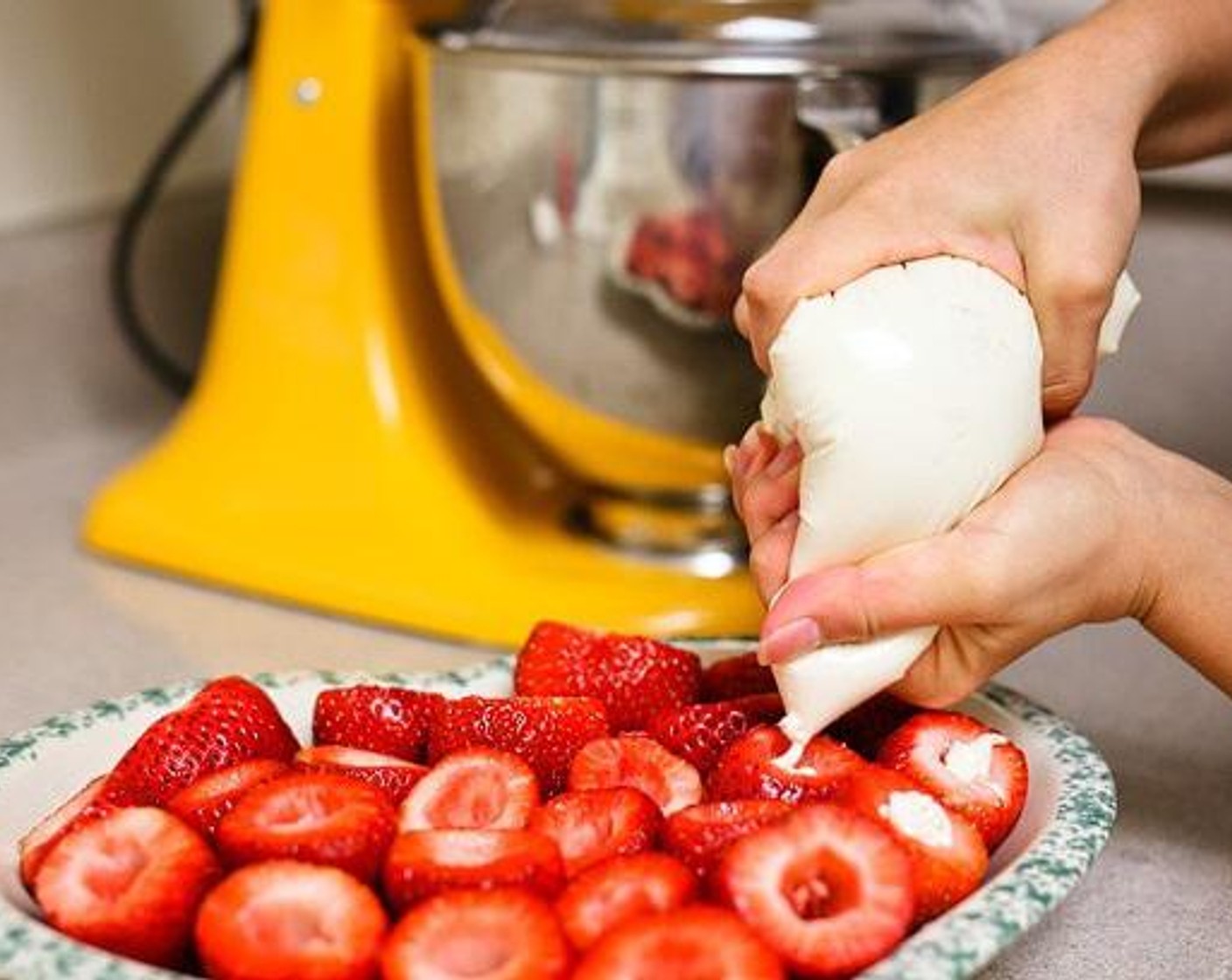 step 3 Add cream cheese mix to a piping bag - or Ziploc with the corner cut off. Fill strawberries with the cheesecake mixture.