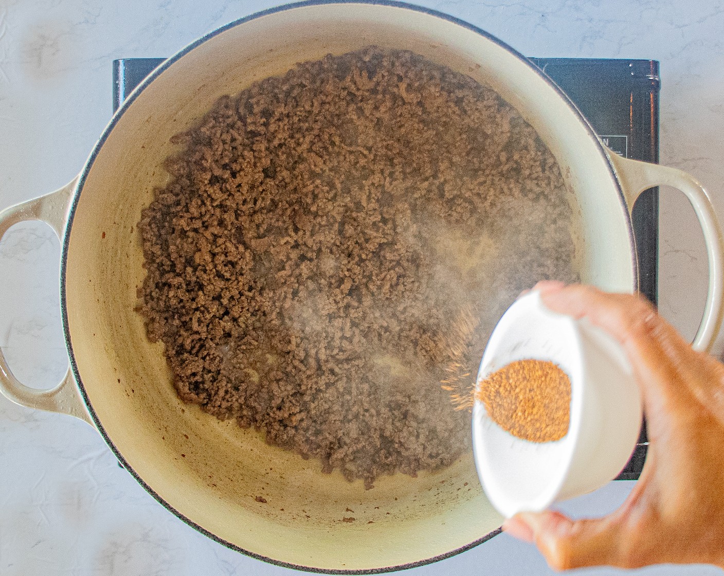 step 3 When cooked through, add the Taco Seasoning (1 Tbsp) and mix in well.